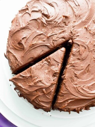 Vegan Chocolate Cake Recipe (V, GF): an easy recipe for supremely rich, perfectly moist chocolate cake that covered in a thick layer of irresistible chocolate frosting! #Vegan #GlutenFree #DairyFree #Chocolate #Cake #Dessert | Recipe on BeamingBaker.com