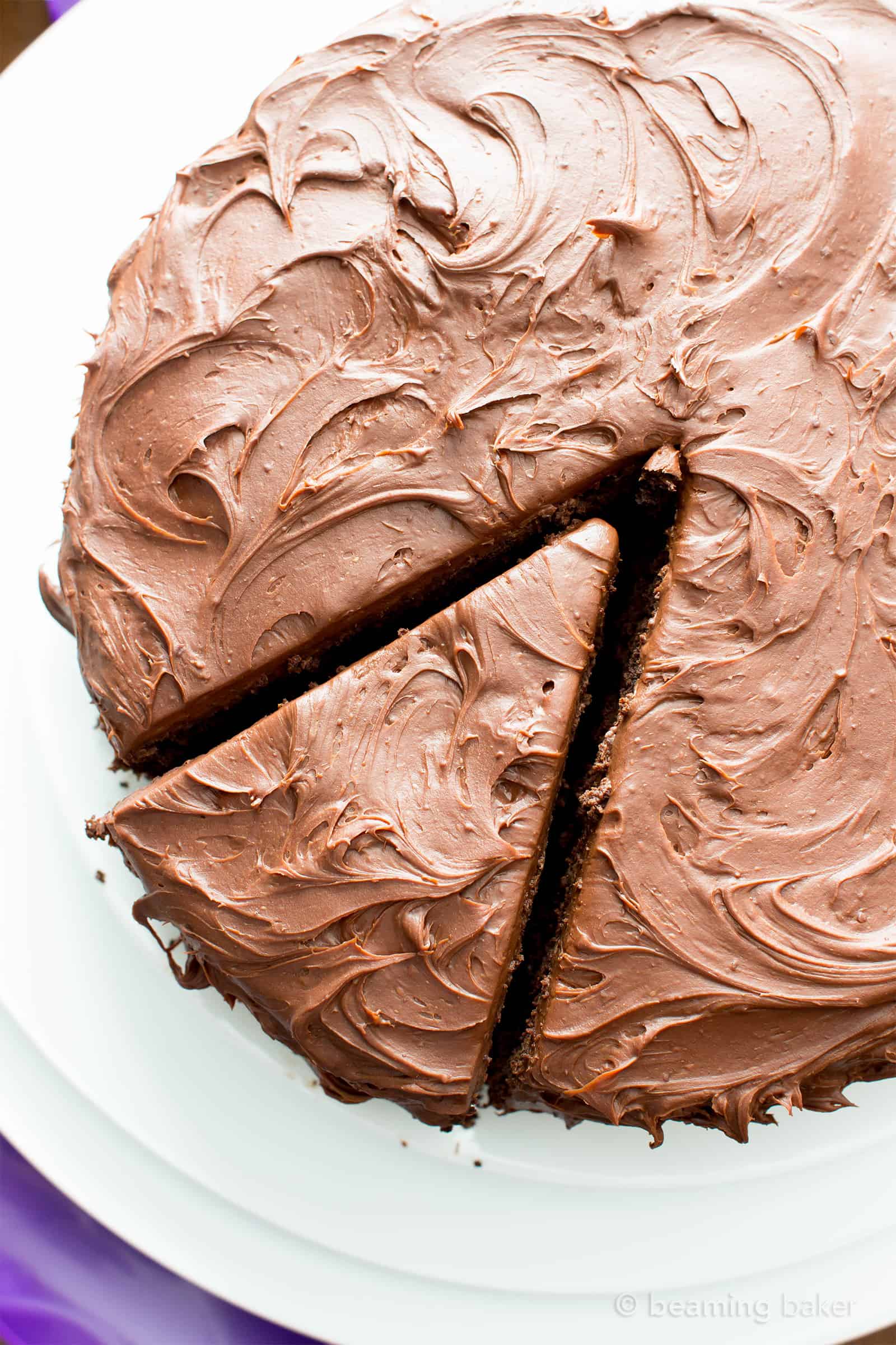 Vegan Chocolate Cake Recipe (V, GF): an easy recipe for supremely rich, perfectly moist chocolate cake that covered in a thick layer of irresistible chocolate frosting! #Vegan #GlutenFree #DairyFree #Chocolate #Cake #Dessert | Recipe on BeamingBaker.com