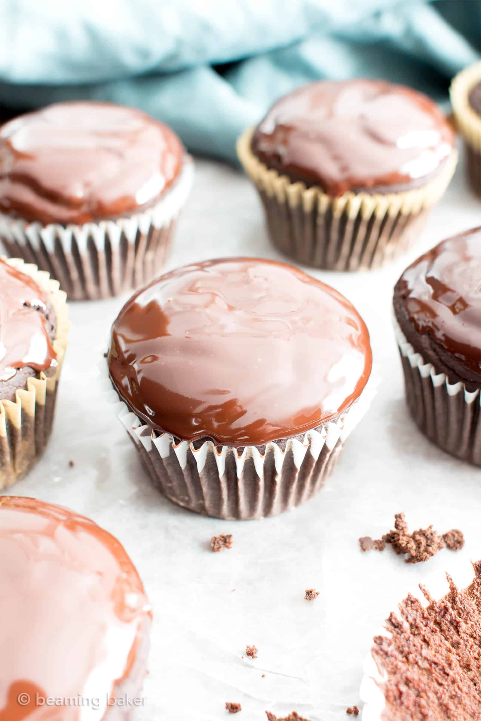 Chocolate Ganache Cupcakes (V, GF): an easy recipe for perfectly moist chocolate cupcakes covered in a thick layer of rich chocolate ganache! #Vegan #GlutenFree #DairyFree #Chocolate #Dessert | Recipe on BeamingBaker.com