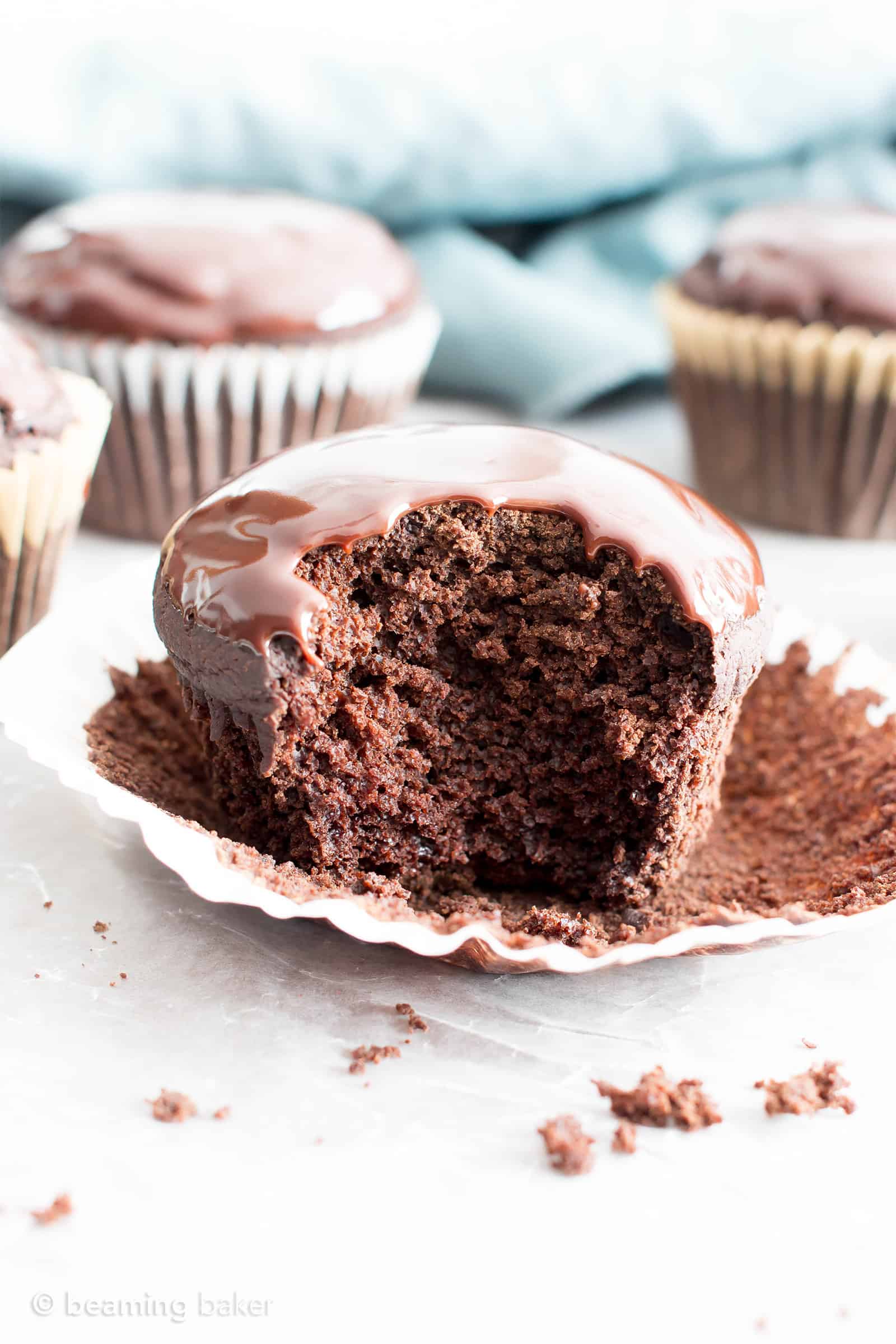 Chocolate Ganache Cupcakes (V, GF): an easy recipe for perfectly moist chocolate cupcakes covered in a thick layer of rich chocolate ganache! #Vegan #GlutenFree #DairyFree #Chocolate #Dessert | Recipe on BeamingBaker.com