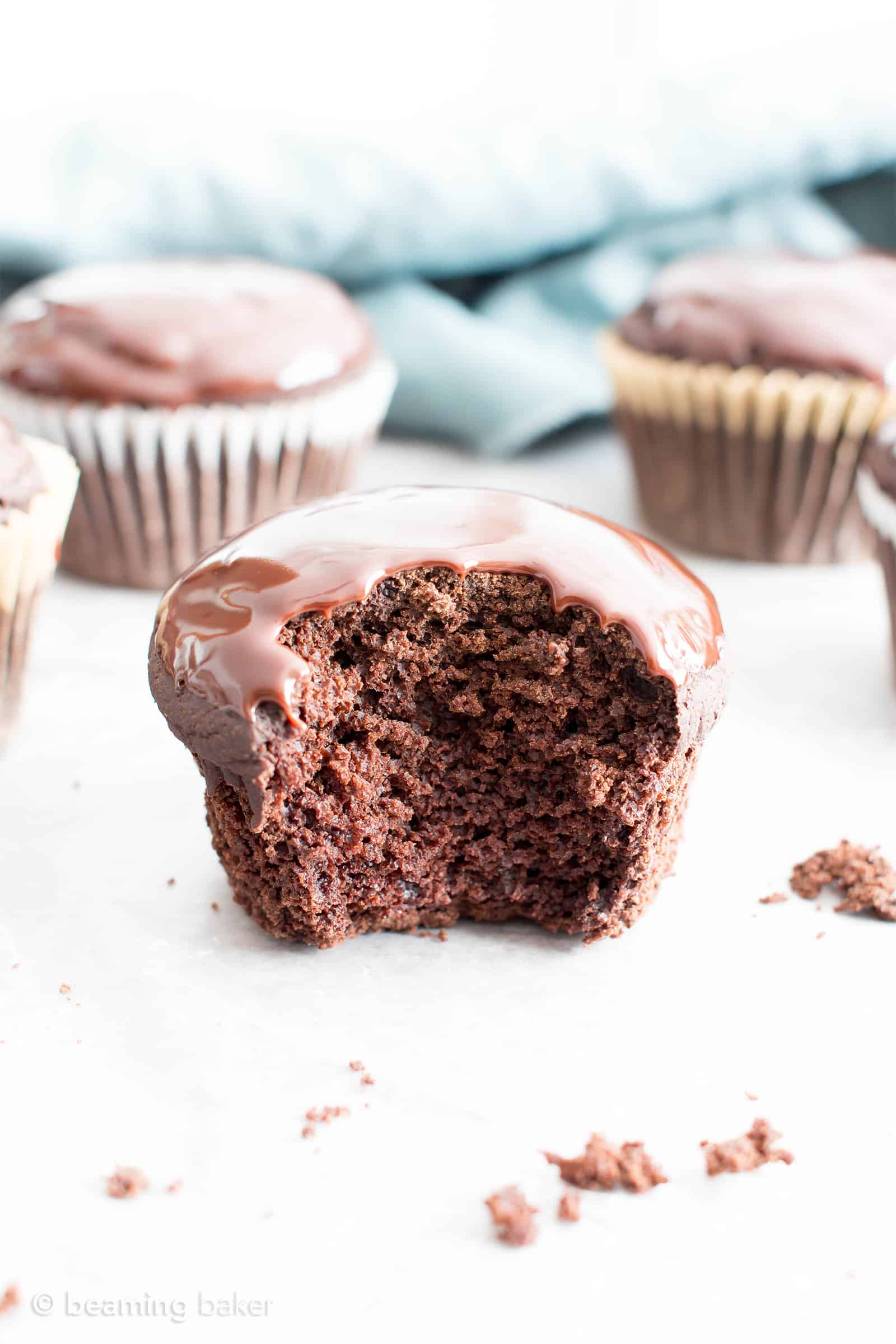 Chocolate Ganache Cupcakes (V, GF): an easy recipe for perfectly moist chocolate cupcakes covered in a thick layer of rich chocolate ganache! #Vegan #GlutenFree #DairyFree #Chocolate #Dessert | Recipe on BeamingBaker.com