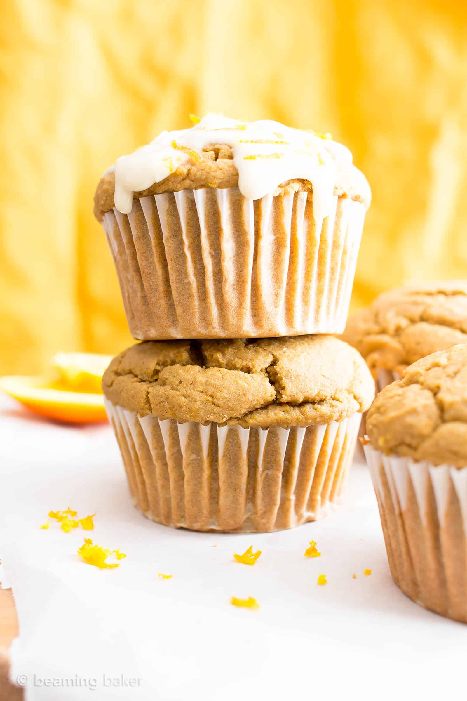Easy Orange Muffins Recipe (V, GF): a fun recipe for perfectly moist homemade muffins bursting with zesty orange flavor! #Vegan #GlutenFree #DairyFree #Breakfast #Muffins | Recipe on BeamingBaker.com 