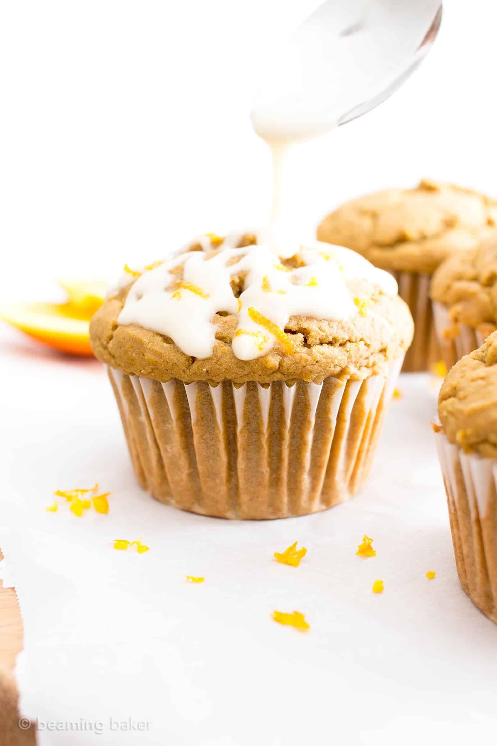 Easy Orange Muffins Recipe (V, GF): a fun recipe for perfectly moist homemade muffins bursting with zesty orange flavor! #Vegan #GlutenFree #DairyFree #Breakfast #Muffins | Recipe on BeamingBaker.com 