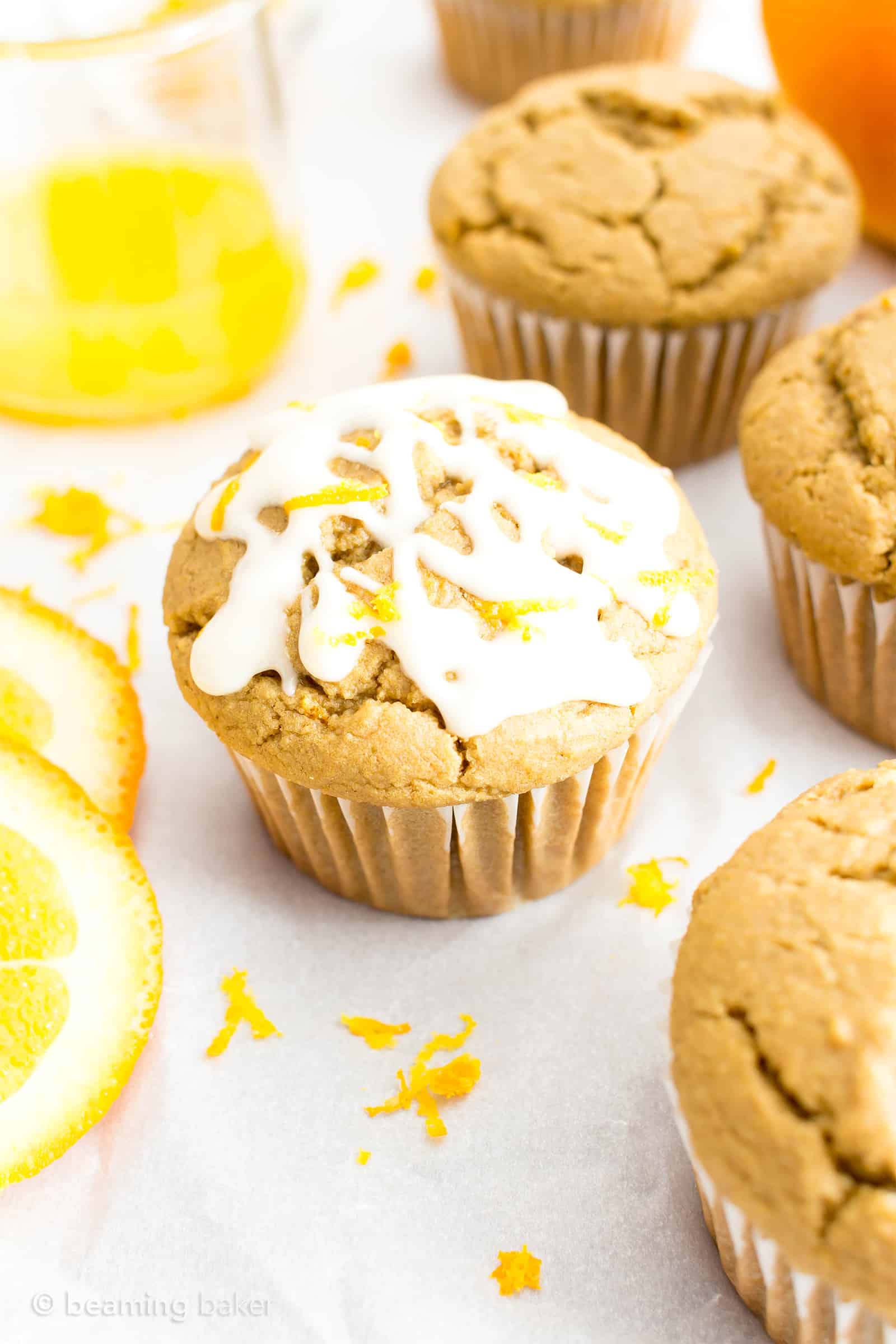 Easy Orange Muffins Recipe (V, GF): a fun recipe for perfectly moist homemade muffins bursting with zesty orange flavor! #Vegan #GlutenFree #DairyFree #Breakfast #Muffins | Recipe on BeamingBaker.com 