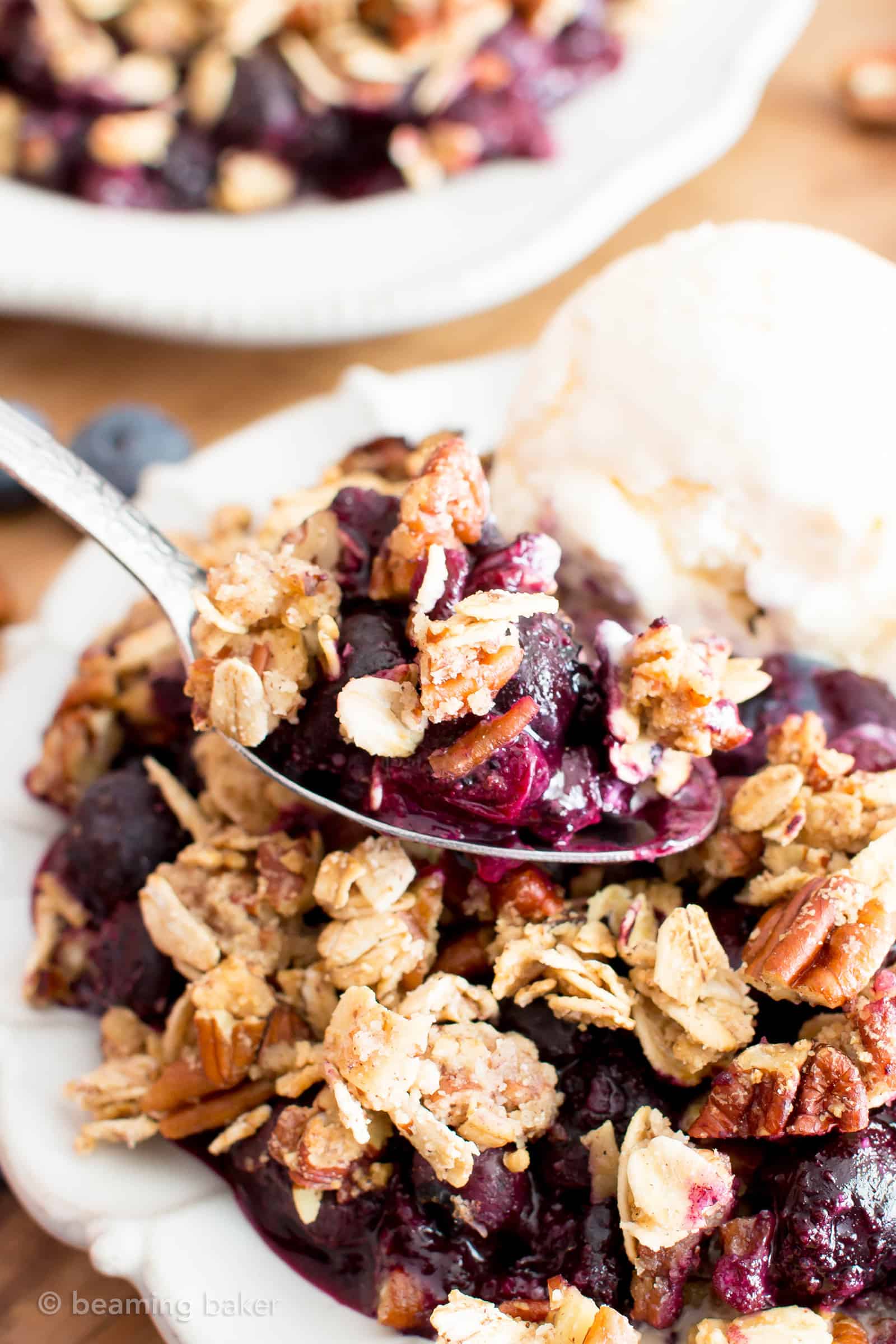 Vegan Gluten Free Blueberry Crisp (V+GF): an easy recipe for delightfully sweet ‘n crisp topping & warm, gooey blueberry filling to make for the perfect healthy summer dessert! #Vegan #GlutenFree #Paleo option #DairyFree #RefinedSugarFree #SummerDesserts #HealthyDesserts | Recipe at BeamingBaker.com