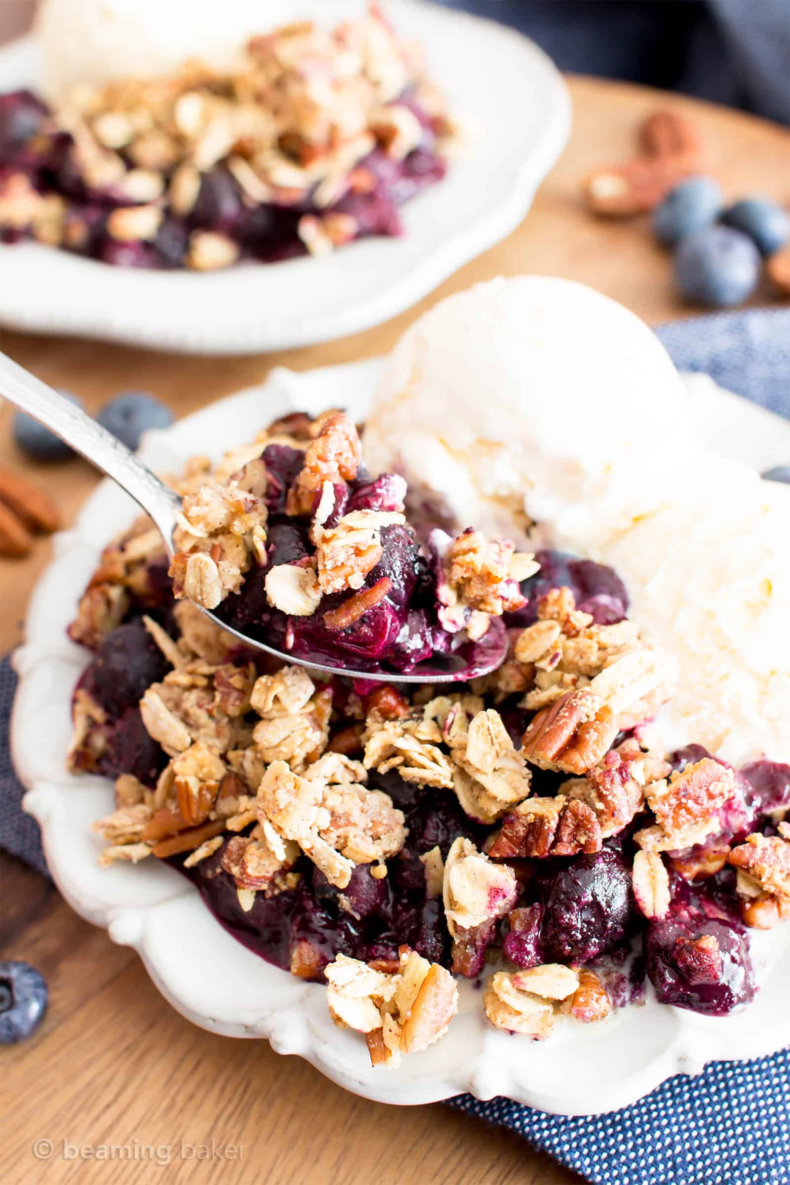 Vegan Gluten Free Blueberry Crisp (V+GF): an easy recipe for delightfully sweet ‘n crisp topping & warm, gooey blueberry filling to make for the perfect healthy summer dessert! #Vegan #GlutenFree #Paleo option #DairyFree #RefinedSugarFree #SummerDesserts #HealthyDesserts | Recipe at BeamingBaker.com