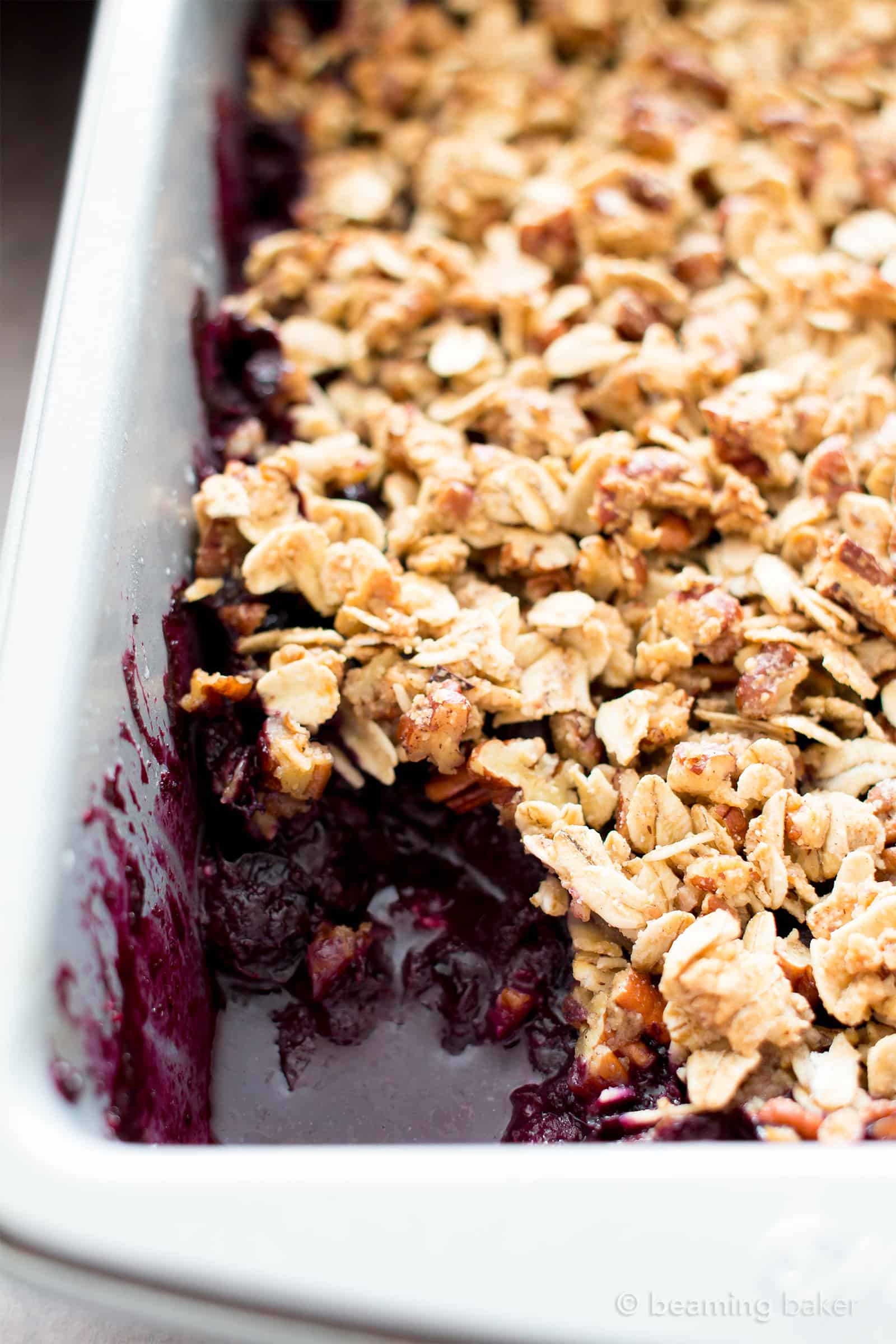 Vegan Gluten Free Blueberry Crisp (V+GF): an easy recipe for delightfully sweet ‘n crisp topping & warm, gooey blueberry filling to make for the perfect healthy summer dessert! #Vegan #GlutenFree #Paleo option #DairyFree #RefinedSugarFree #SummerDesserts #HealthyDesserts | Recipe at BeamingBaker.com