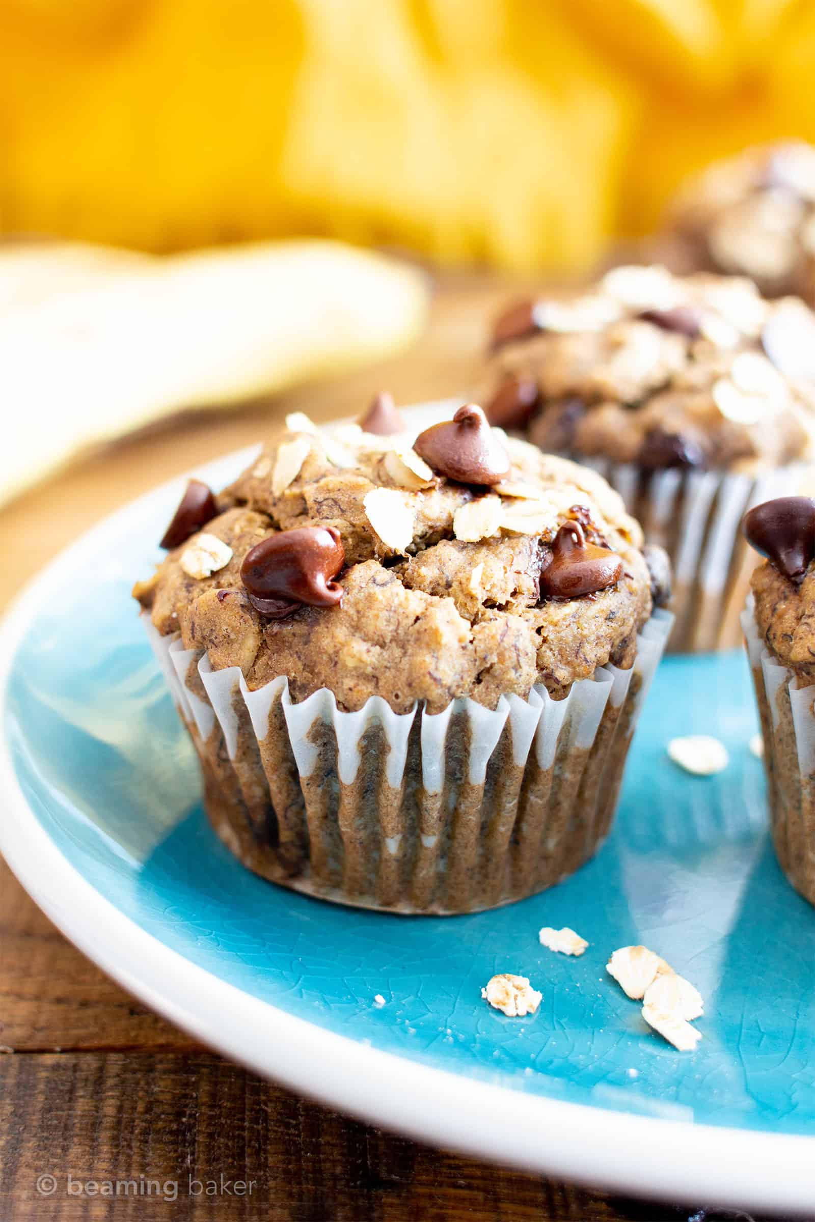 Banana Oatmeal Chocolate Chip Muffins (V, GF): a healthy 1-bowl recipe for moist, satisfying fresh-baked banana muffins bursting with hearty oats and decadent chocolate chips. #Bananas #Vegan #GlutenFree #Muffins #Healthy #Oats | Recipe at BeamingBaker.com