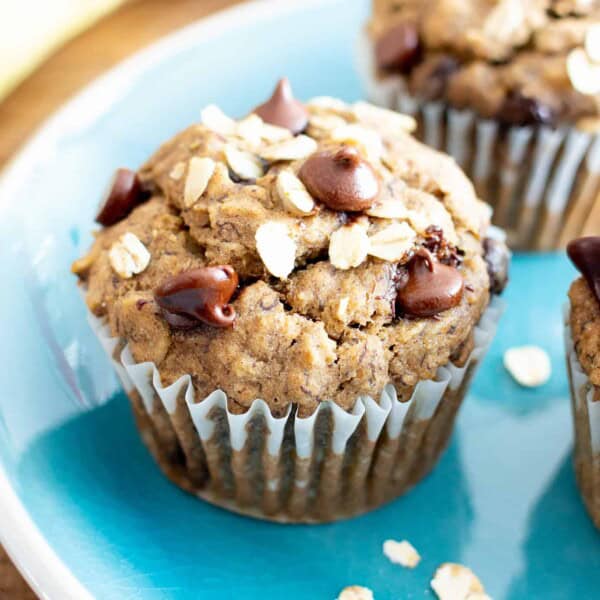 Banana Oatmeal Chocolate Chip Muffins (V, GF): a healthy 1-bowl recipe for moist, satisfying fresh-baked banana muffins bursting with hearty oats and decadent chocolate chips. #Bananas #Vegan #GlutenFree #Muffins #Healthy #Oats | Recipe at BeamingBaker.com