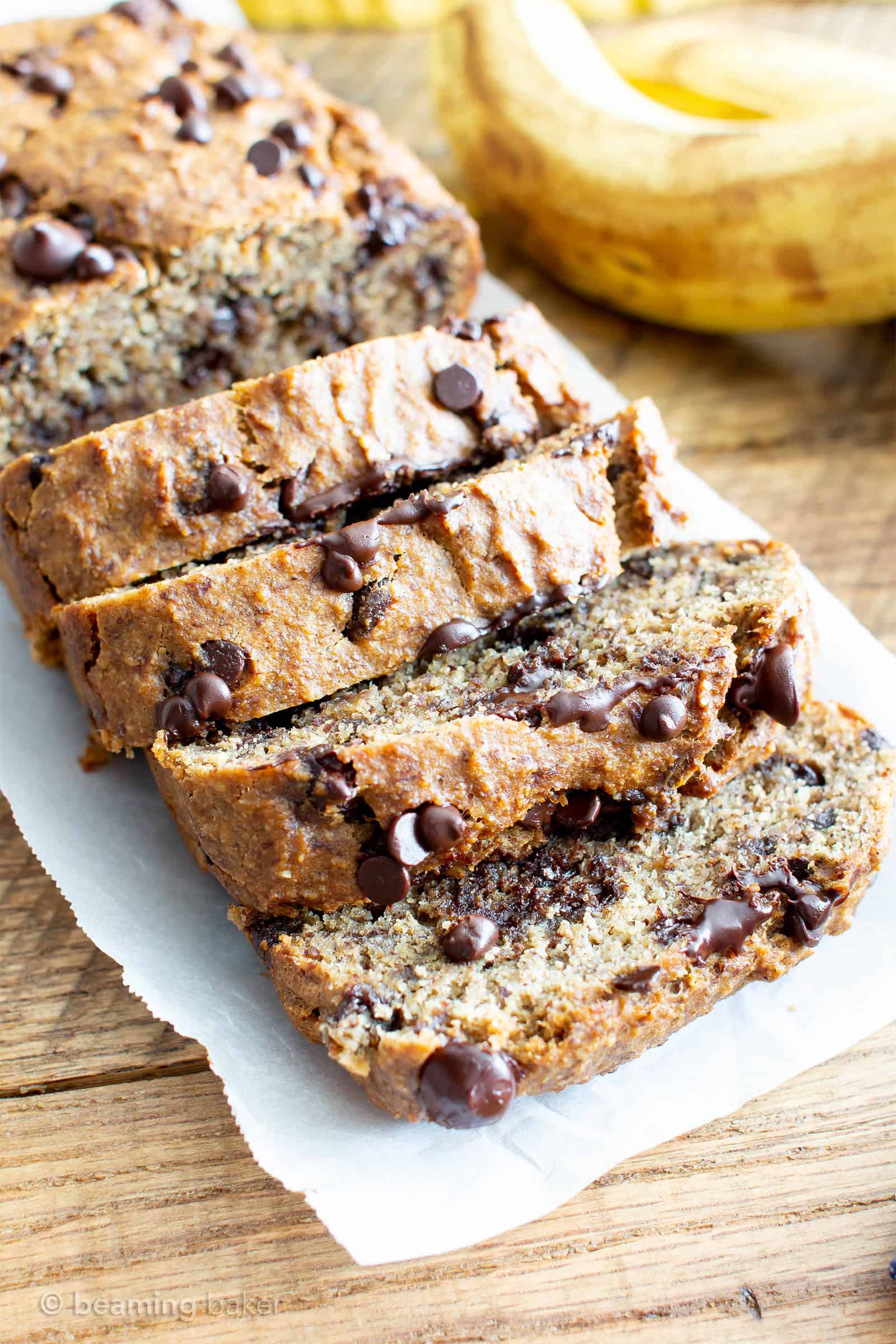 Best Moist Chocolate Chip Banana Bread Recipe (V, GF): a one bowl recipe for deliciously moist banana bread bursting with chocolate and made with healthy, whole ingredients. #Vegan #GlutenFree #DairyFree #Healthy #QuickBreads | Recipe at BeamingBaker.com