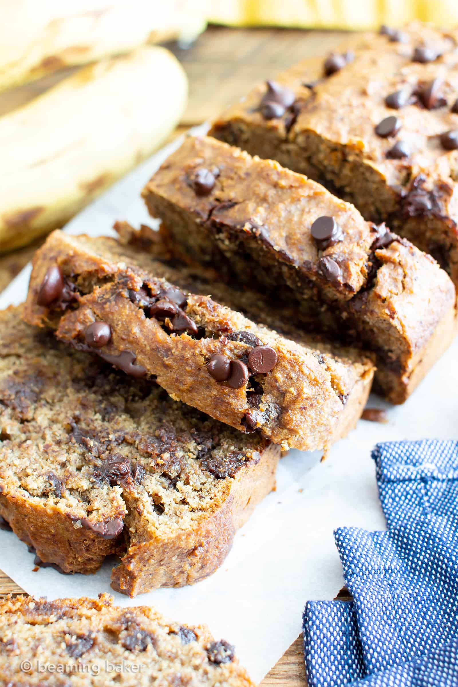 Best Moist Chocolate Chip Banana Bread Recipe (V, GF): a one bowl recipe for deliciously moist banana bread bursting with chocolate and made with healthy, whole ingredients. #Vegan #GlutenFree #DairyFree #Healthy #QuickBreads | Recipe at BeamingBaker.com