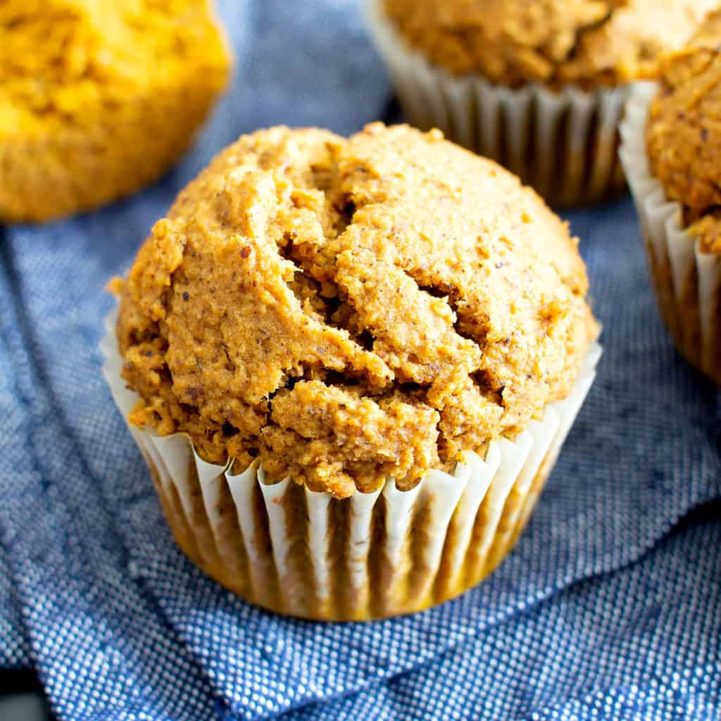 Easy Vegan Gluten Free Pumpkin Muffins Recipe (V, GF): an easy recipe for moist ‘n fluffy pumpkin muffins bursting with your favorite fall spices. Made with healthy, whole ingredients. #Vegan #GlutenFree #Pumpkin #Muffins #PumpkinSpice #DairyFree #Healthy #Fall #RefinedSugarFree | Recipe at BeamingBaker.com