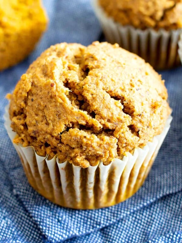 Easy Vegan Gluten Free Pumpkin Muffins Recipe (V, GF): an easy recipe for moist ‘n fluffy pumpkin muffins bursting with your favorite fall spices. Made with healthy, whole ingredients. #Vegan #GlutenFree #Pumpkin #Muffins #PumpkinSpice #DairyFree #Healthy #Fall #RefinedSugarFree | Recipe at BeamingBaker.com