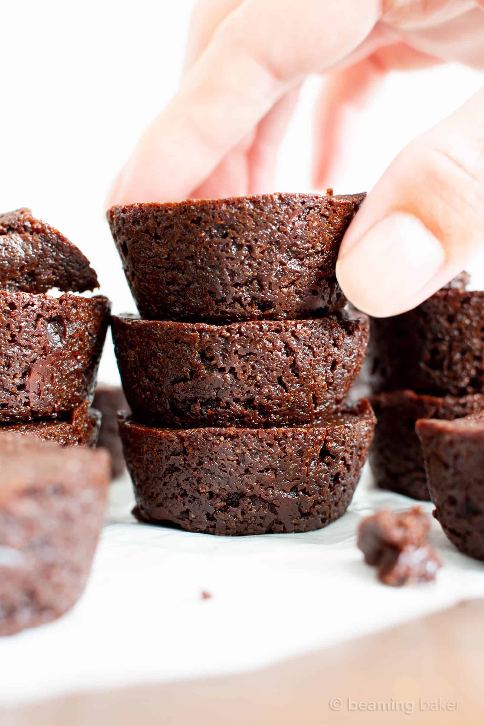 Mini Vegan Brownie Bites Recipe (V, GF): an easy recipe for soft, fudgy ‘n moist two bite mini brownies bursting with rich, chocolate flavor. Made with healthy, whole ingredients. #Vegan #GlutenFree #DairyFree #Brownies #VeganBaking #Chocolate | Recipe at BeamingBaker.com