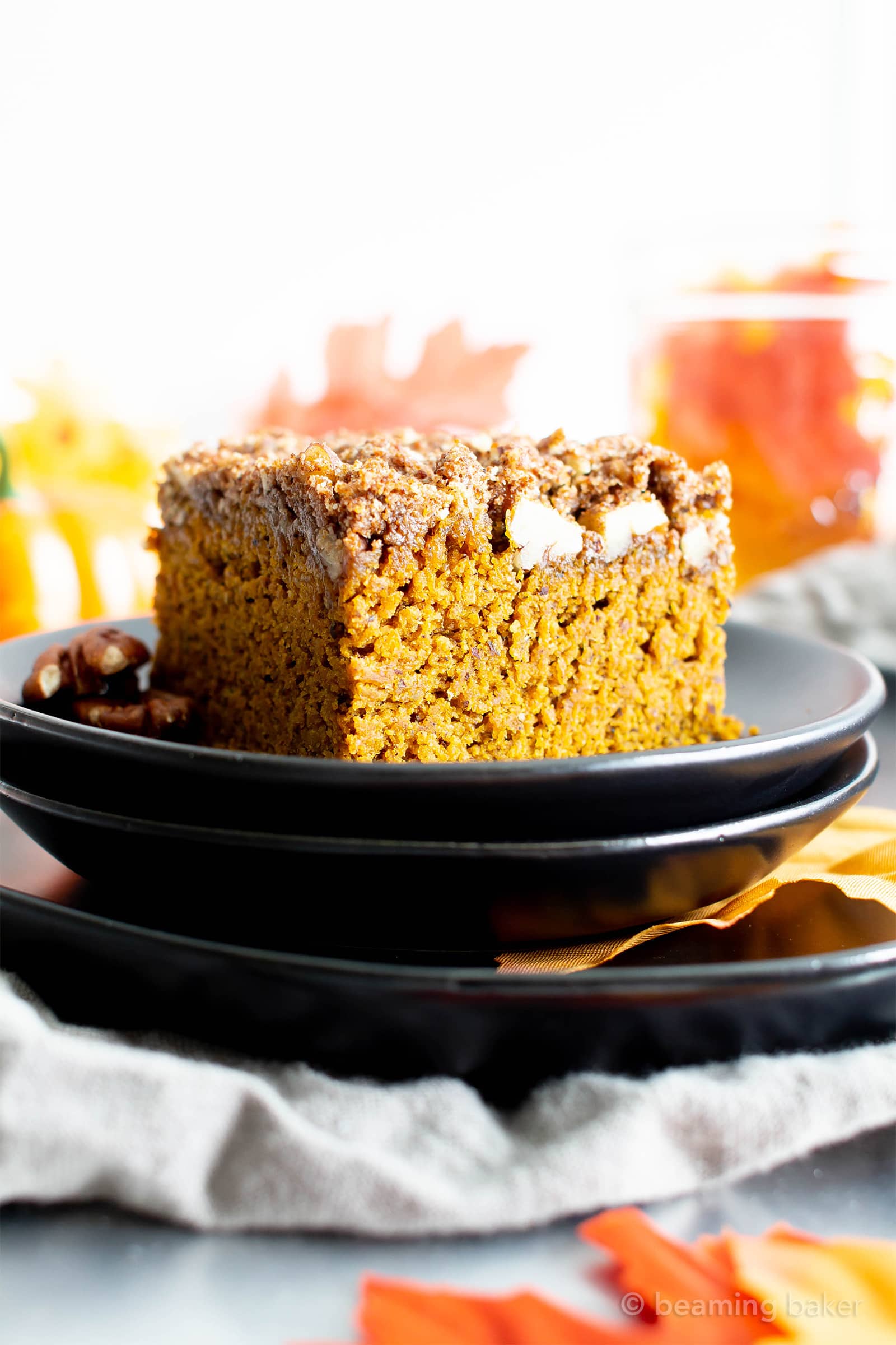 This vegan gluten free pumpkin coffee cake recipe yields a thick layer of moist, healthy pumpkin cake with a cinnamon sweet, buttery-rich topping. The best gluten free pumpkin dessert—tastes like vegan spice cake & made with healthy ingredients. #Pumpkin #Vegan #GlutenFree #Healthy #CoffeeCake | Recipe at BeamingBaker.com