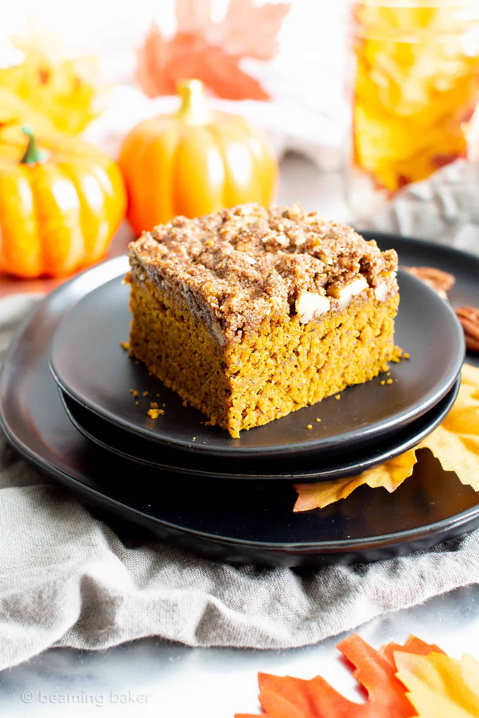 This vegan gluten free pumpkin coffee cake recipe yields a thick layer of moist, healthy pumpkin cake with a cinnamon sweet, buttery-rich topping. The best gluten free pumpkin dessert—tastes like vegan spice cake & made with healthy ingredients. #Pumpkin #Vegan #GlutenFree #Healthy #CoffeeCake | Recipe at BeamingBaker.com