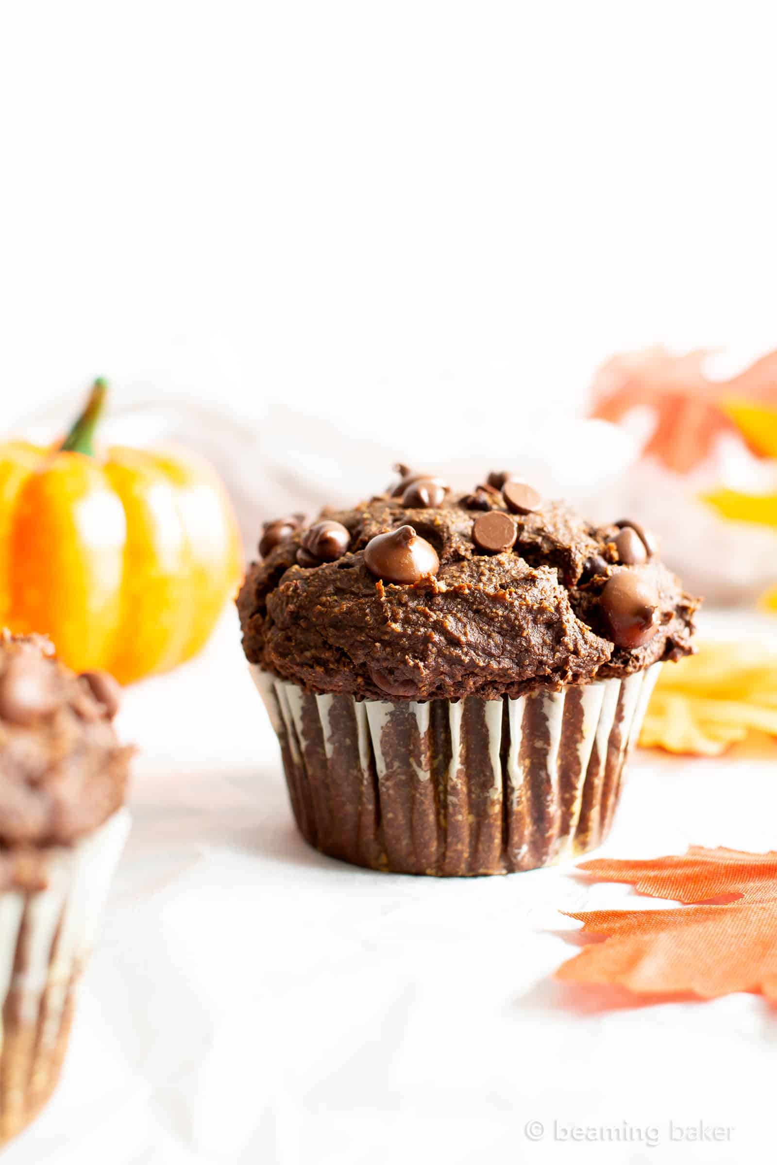 Easy Gluten Free Chocolate Pumpkin Muffins (V, GF): a one bowl recipe for moist, fudgy chocolate pumpkin muffins packed with rich fall flavors! Made with healthy, whole ingredients. #Vegan #GlutenFree #Muffins #Pumpkin #Fall #Chocolate #CleanEating | Recipe at BeamingBaker.com