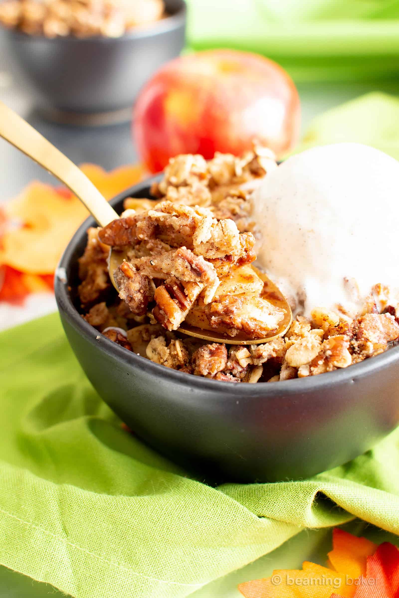 Vegan Gluten Free Cinnamon Apple Crisp with Oats (V, GF): an easy recipe for a warm, gooey apple crisp with delicious cinnamon oat topping. Made with healthy ingredients. #Vegan #GlutenFree #GlutenFreeVegan #AppleCrisp #HealthyDesserts #Fall | Recipe at BeamingBaker.com