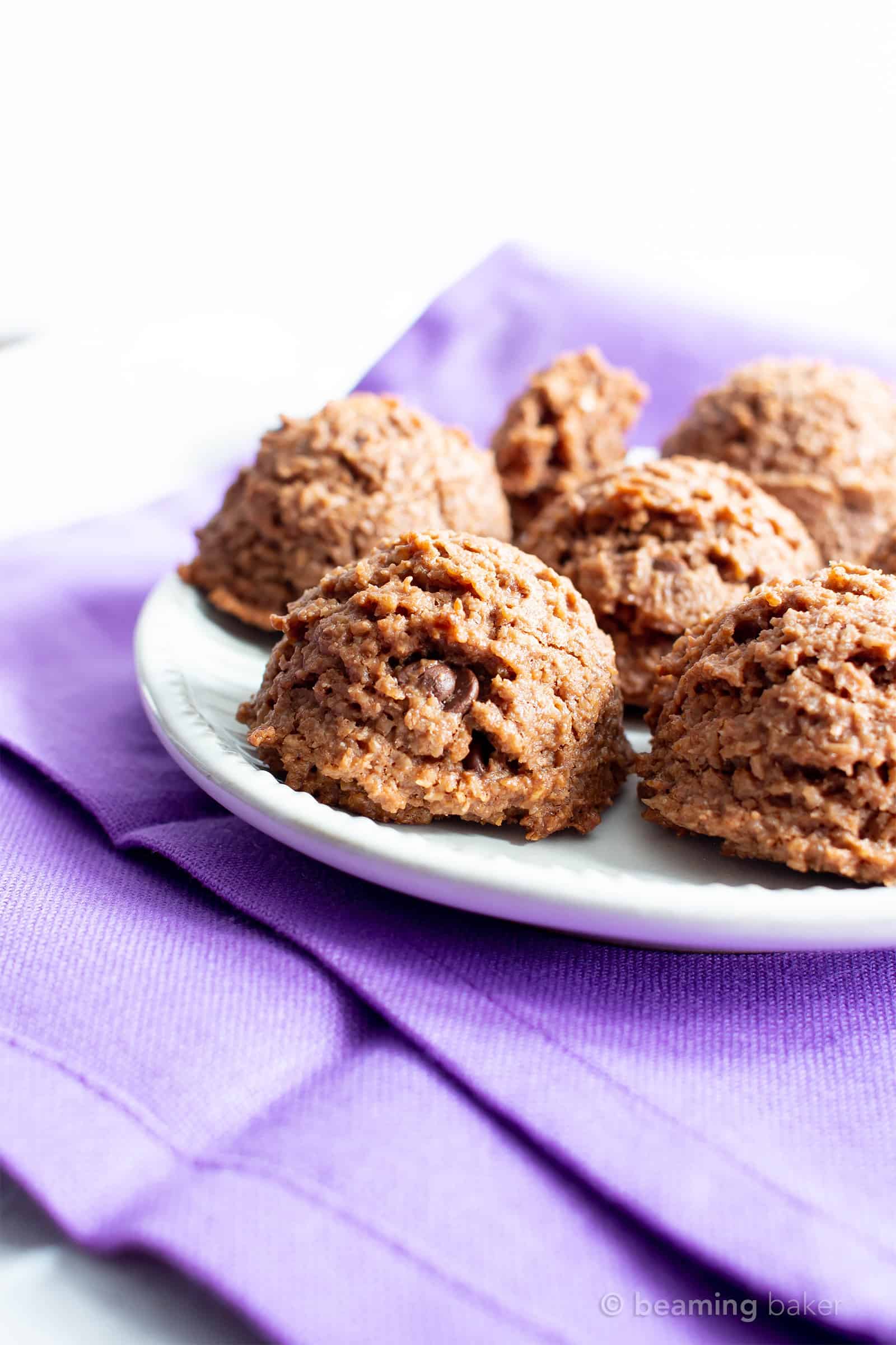 Paleo Chocolate Coconut Macaroons Recipe (V, GF): an easy recipe for deliciously chewy chocolate macaroon cookies bursting with 2x the amount of chocolate! Made with healthy, whole ingredients. #Paleo #Vegan #GlutenFree #Coconut #Macaroons #PaleoDesserts #CleanEating | Recipe at BeamingBaker.com