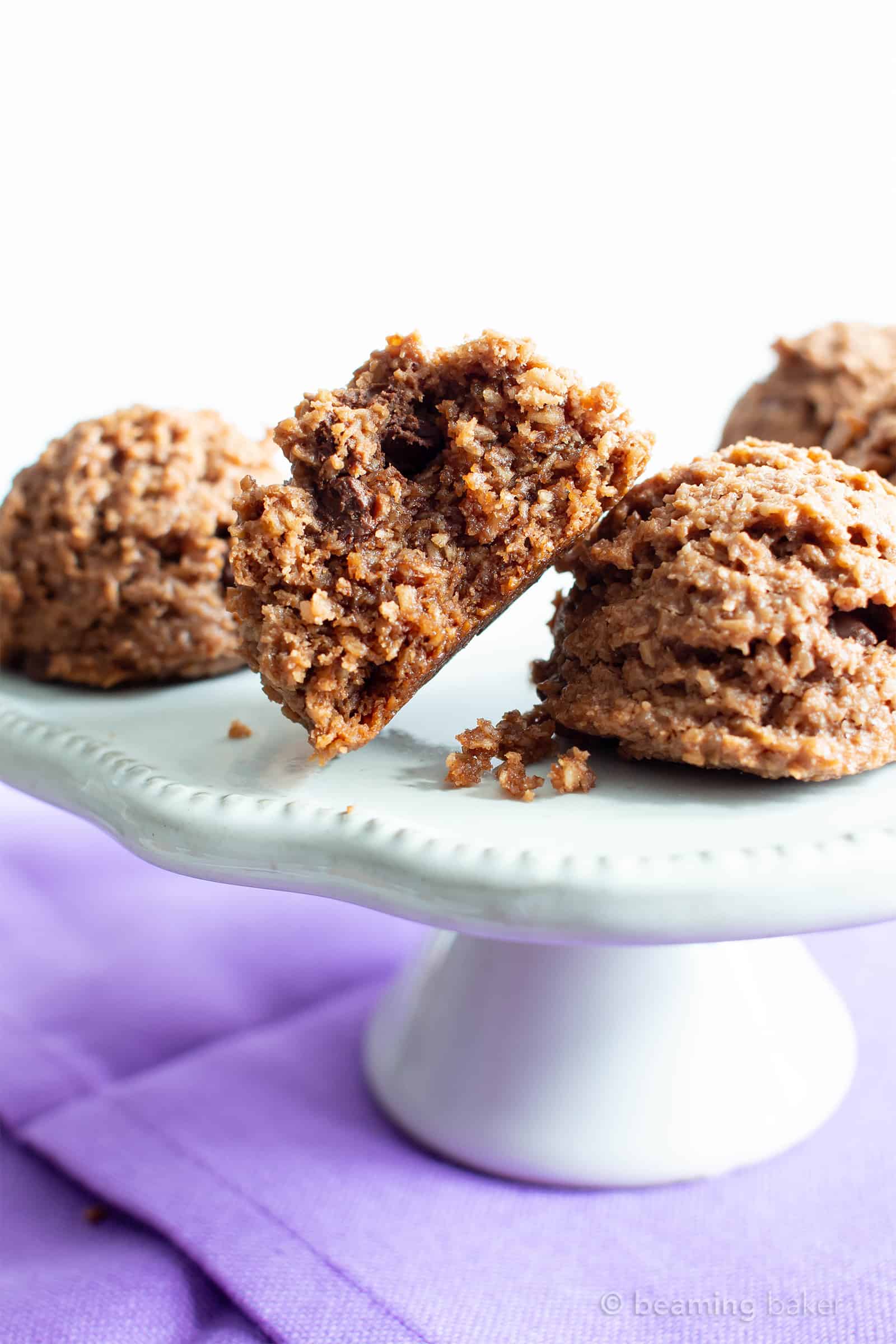 Paleo Chocolate Coconut Macaroons Recipe (V, GF): an easy recipe for deliciously chewy chocolate macaroon cookies bursting with 2x the amount of chocolate! Made with healthy, whole ingredients. #Paleo #Vegan #GlutenFree #Coconut #Macaroons #PaleoDesserts #CleanEating | Recipe at BeamingBaker.com