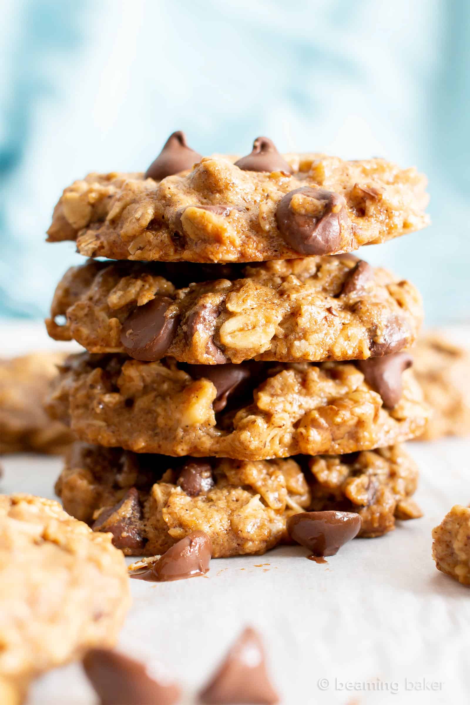 Easy Healthy Oatmeal Chocolate Chip Cookies: this easy healthy oatmeal chocolate chip cookies recipe yields chewy cookies with crispy edges and lots of chocolate chips! Vegan, Gluten-Free, Dairy-Free, Healthy. #Healthy #OatmealCookies #HealthyCookies #ChocolateChip | Recipe at BeamingBaker.com