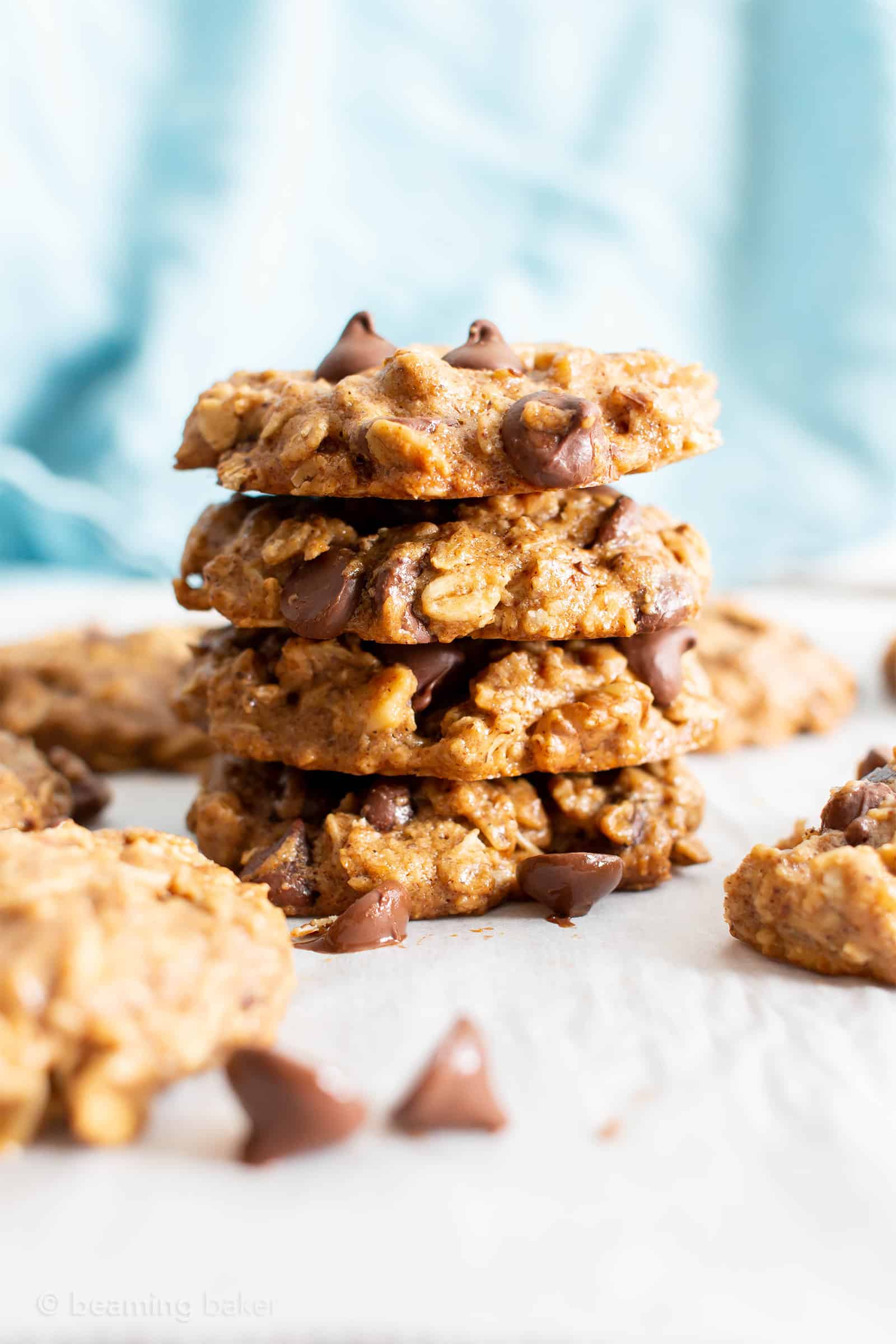 Easy Healthy Oatmeal Chocolate Chip Cookies: this easy healthy oatmeal chocolate chip cookies recipe yields chewy cookies with crispy edges and lots of chocolate chips! Vegan, Gluten-Free, Dairy-Free, Healthy. #Healthy #OatmealCookies #HealthyCookies #ChocolateChip | Recipe at BeamingBaker.com