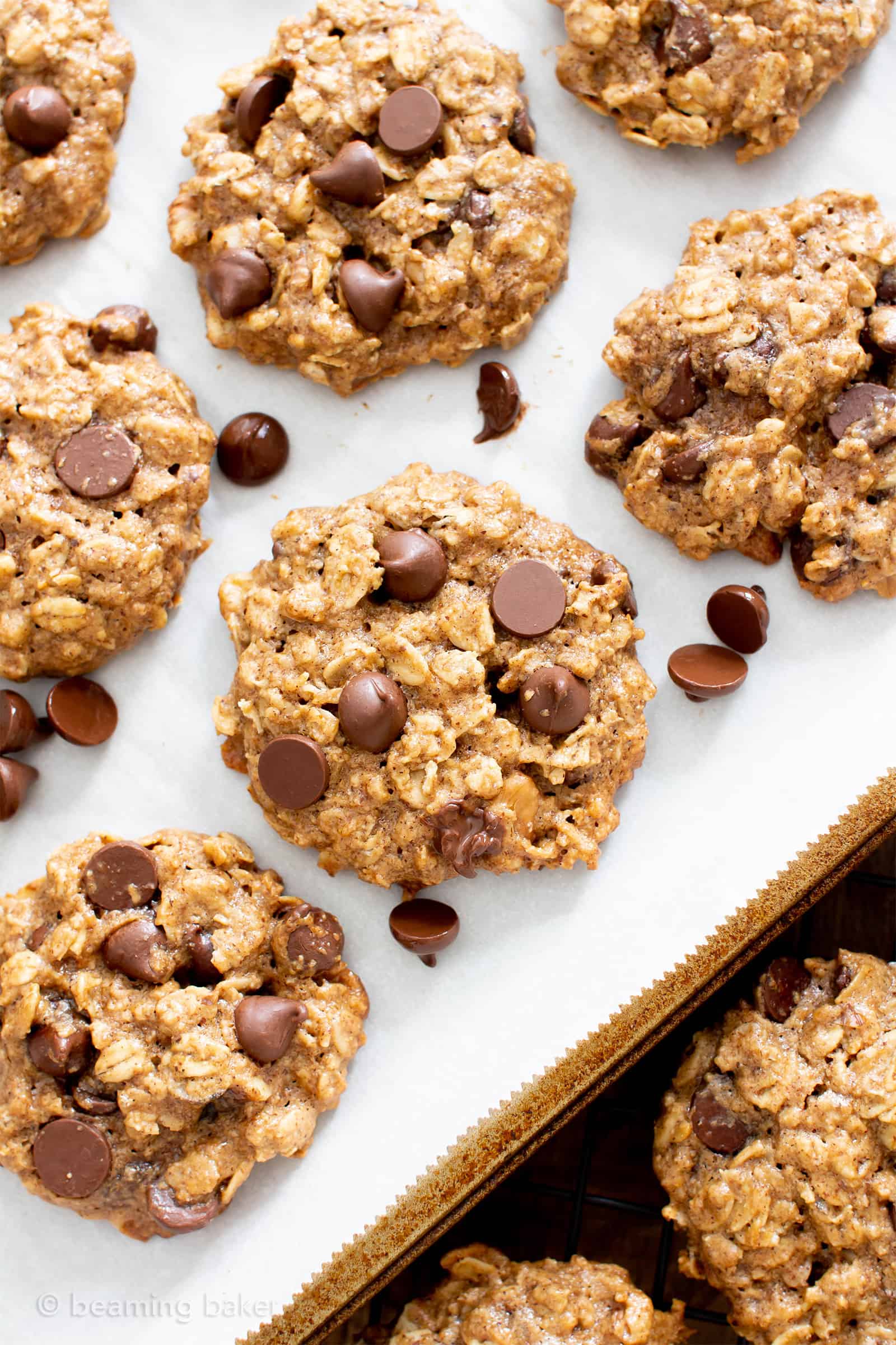 Easy Healthy Oatmeal Chocolate Chip Cookies: this easy healthy oatmeal chocolate chip cookies recipe yields chewy cookies with crispy edges and lots of chocolate chips! Vegan, Gluten-Free, Dairy-Free, Healthy. #Healthy #OatmealCookies #HealthyCookies #ChocolateChip | Recipe at BeamingBaker.com