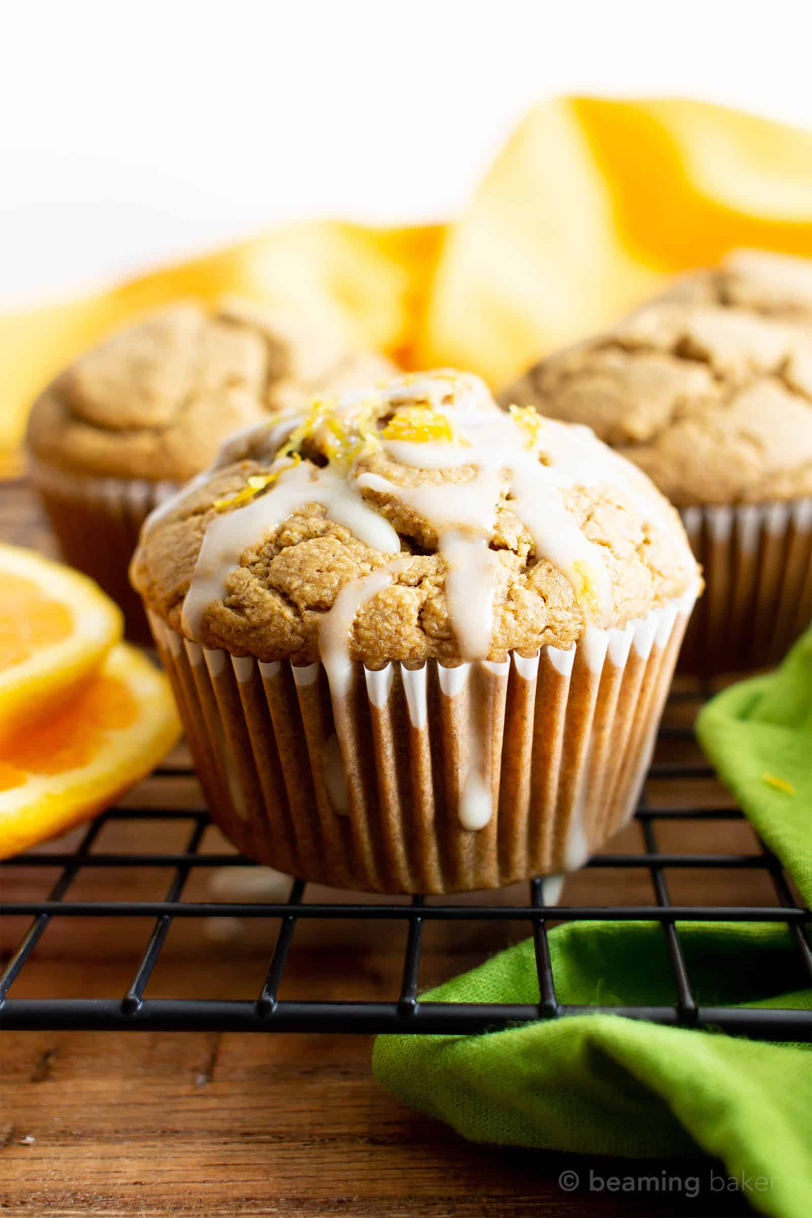 Healthy Gluten Free Orange Cardamom Muffins Recipe (V, GF): an easy, 1-bowl recipe for soft, fluffy orange muffins with a hint of delicious cardamom flavor. Made with healthy ingredients. #Vegan #GlutenFree #DairyFree #HealthyMuffins #GlutenFreeVegan #BeamingBaker | Recipe at BeamingBaker.com