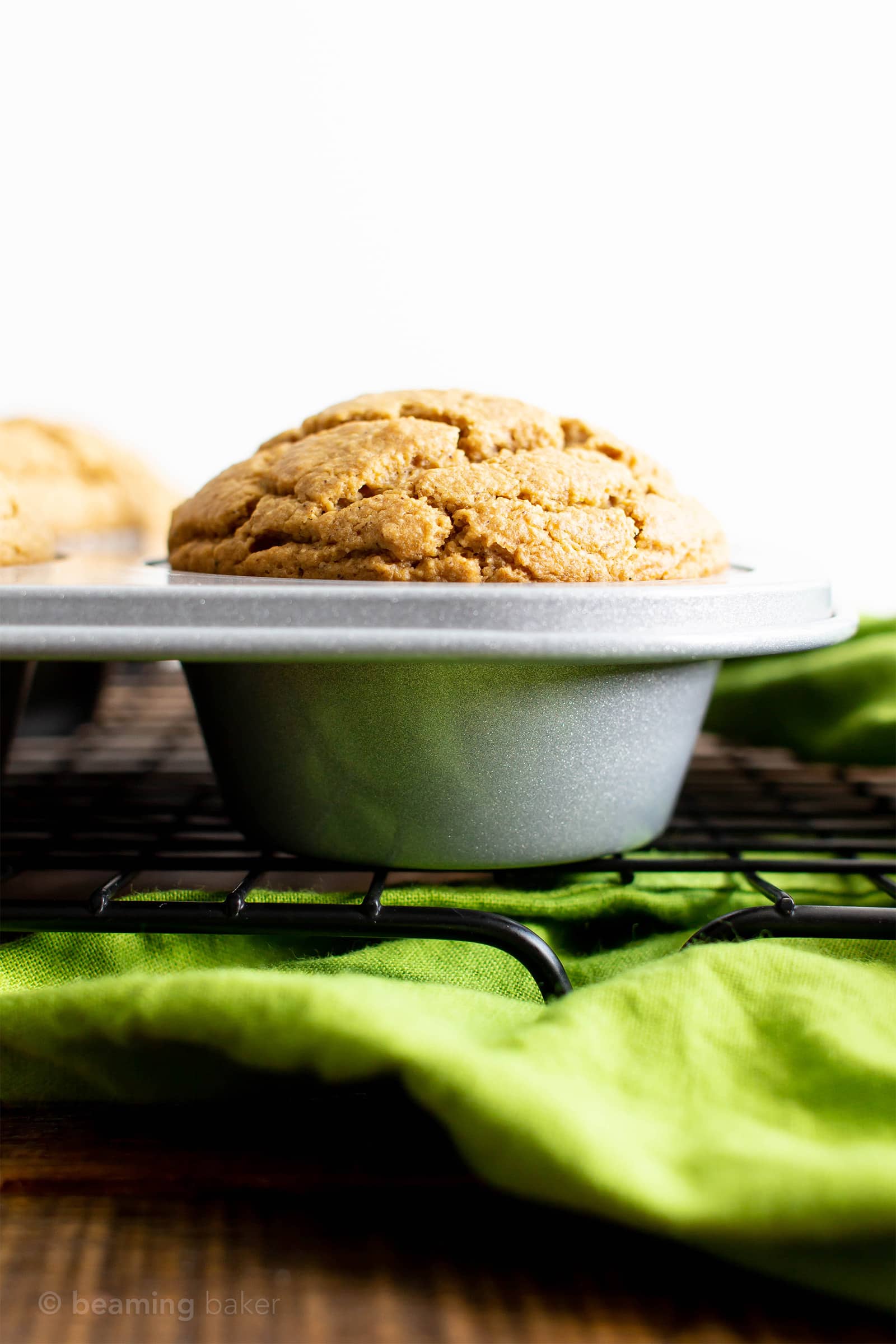 Healthy Gluten Free Orange Cardamom Muffins Recipe (V, GF): an easy, 1-bowl recipe for soft, fluffy orange muffins with a hint of delicious cardamom flavor. Made with healthy ingredients. #Vegan #GlutenFree #DairyFree #HealthyMuffins #GlutenFreeVegan #BeamingBaker | Recipe at BeamingBaker.com