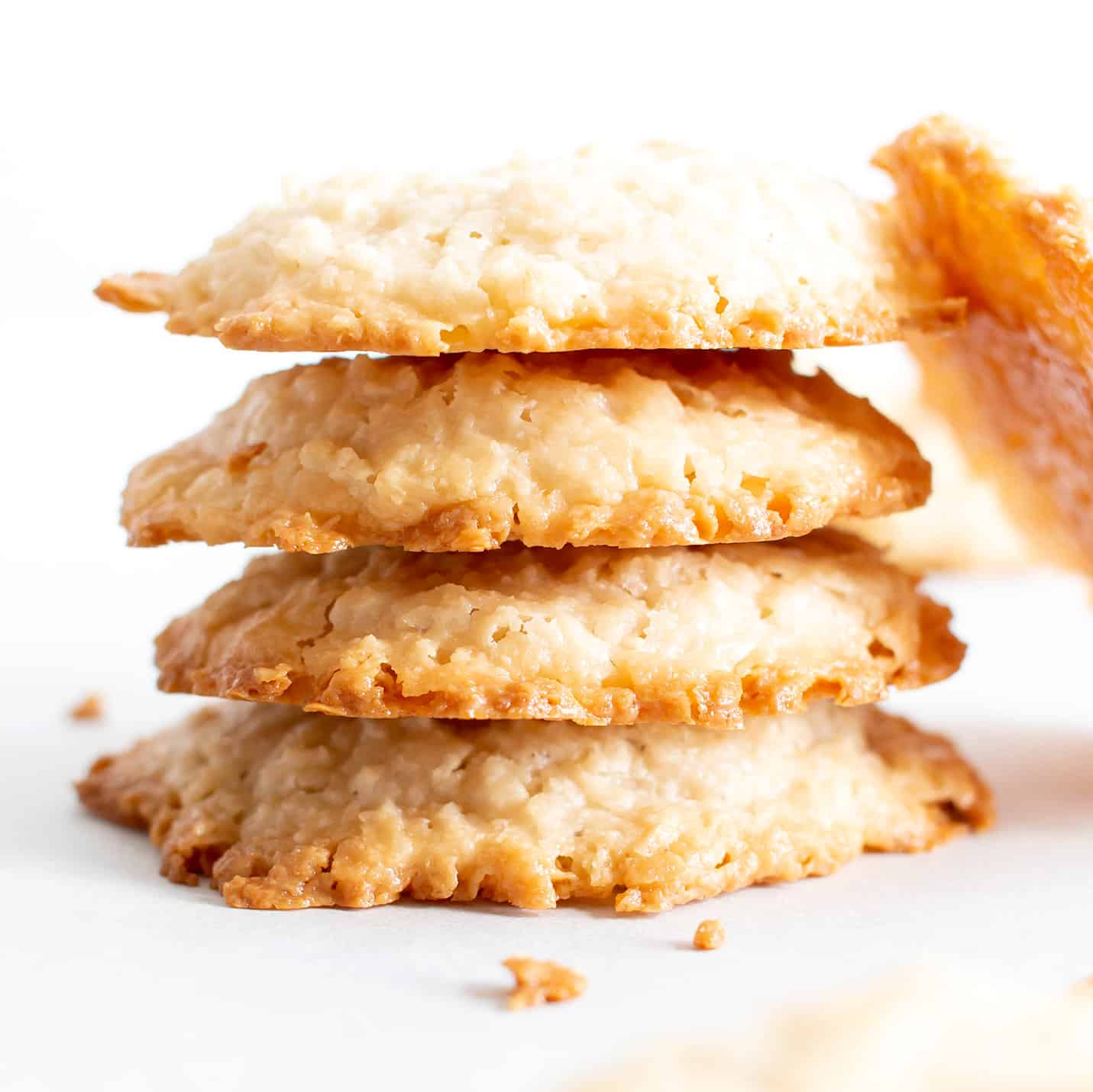 4 Ingredient Vegan Coconut Cookies: chewy, crispy healthy coconut cookies bursting with coconut flavor. The best gluten free coconut cookies—paleo ingredients, delicious! #Vegan #Cookies #Paleo #Healthy #Coconut | Recipe at BeamingBaker.com