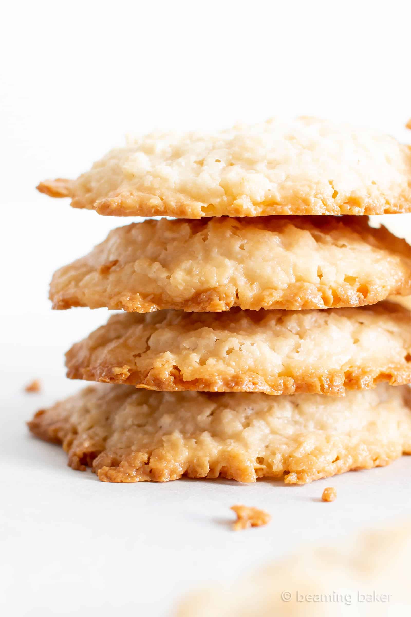 4 Ingredient Vegan Coconut Cookies: chewy, crispy healthy coconut cookies bursting with coconut flavor. The best gluten free coconut cookies—paleo ingredients, delicious! #Vegan #Cookies #Paleo #Healthy #Coconut | Recipe at BeamingBaker.com