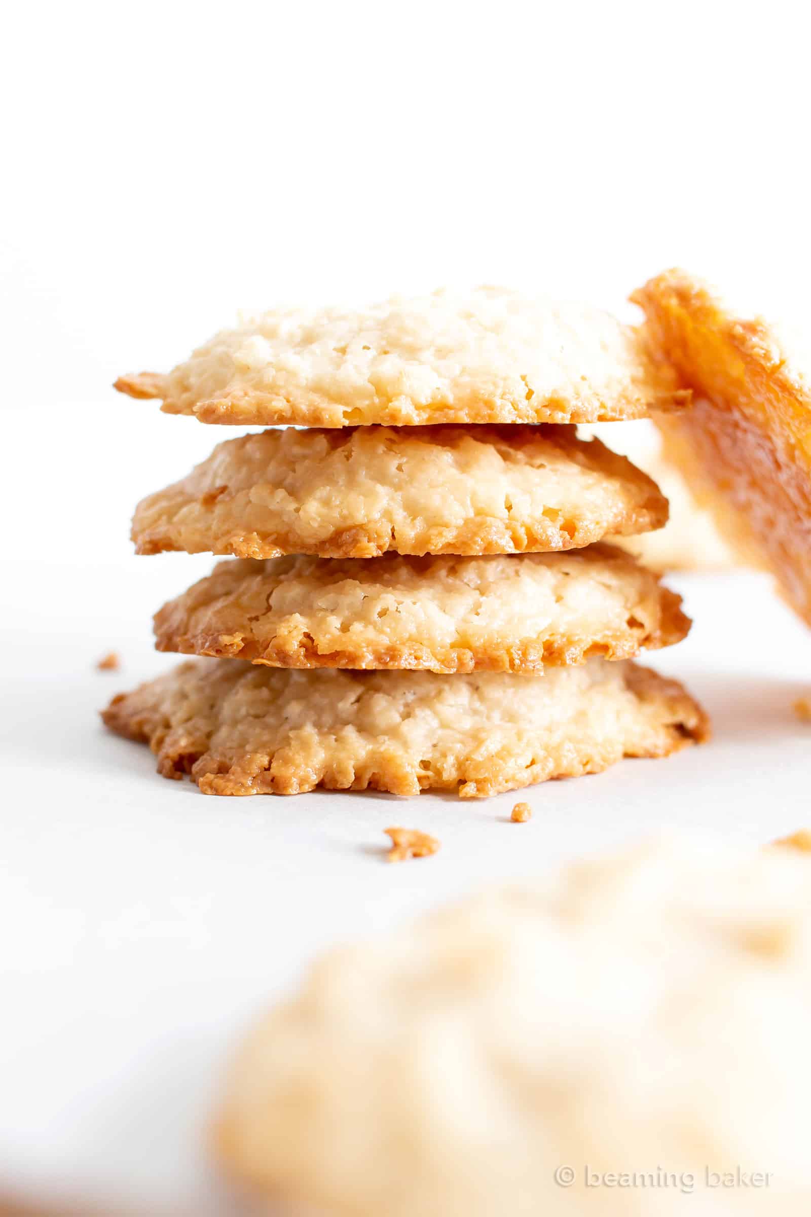 4 Ingredient Vegan Coconut Cookies: chewy, crispy healthy coconut cookies bursting with coconut flavor. The best gluten free coconut cookies—paleo ingredients, delicious! #Vegan #Cookies #Paleo #Healthy #Coconut | Recipe at BeamingBaker.com