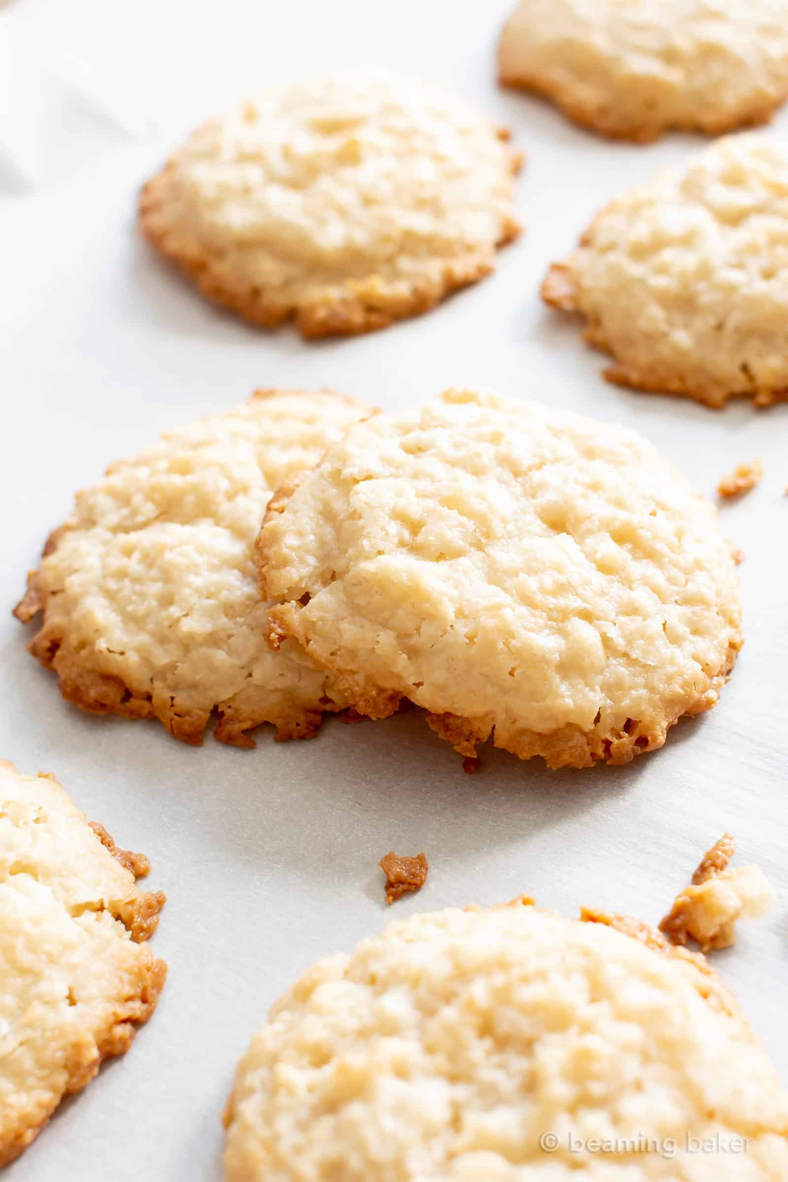 4 Ingredient Vegan Coconut Cookies: chewy, crispy healthy coconut cookies bursting with coconut flavor. The best gluten free coconut cookies—paleo ingredients, delicious! #Vegan #Cookies #Paleo #Healthy #Coconut | Recipe at BeamingBaker.com