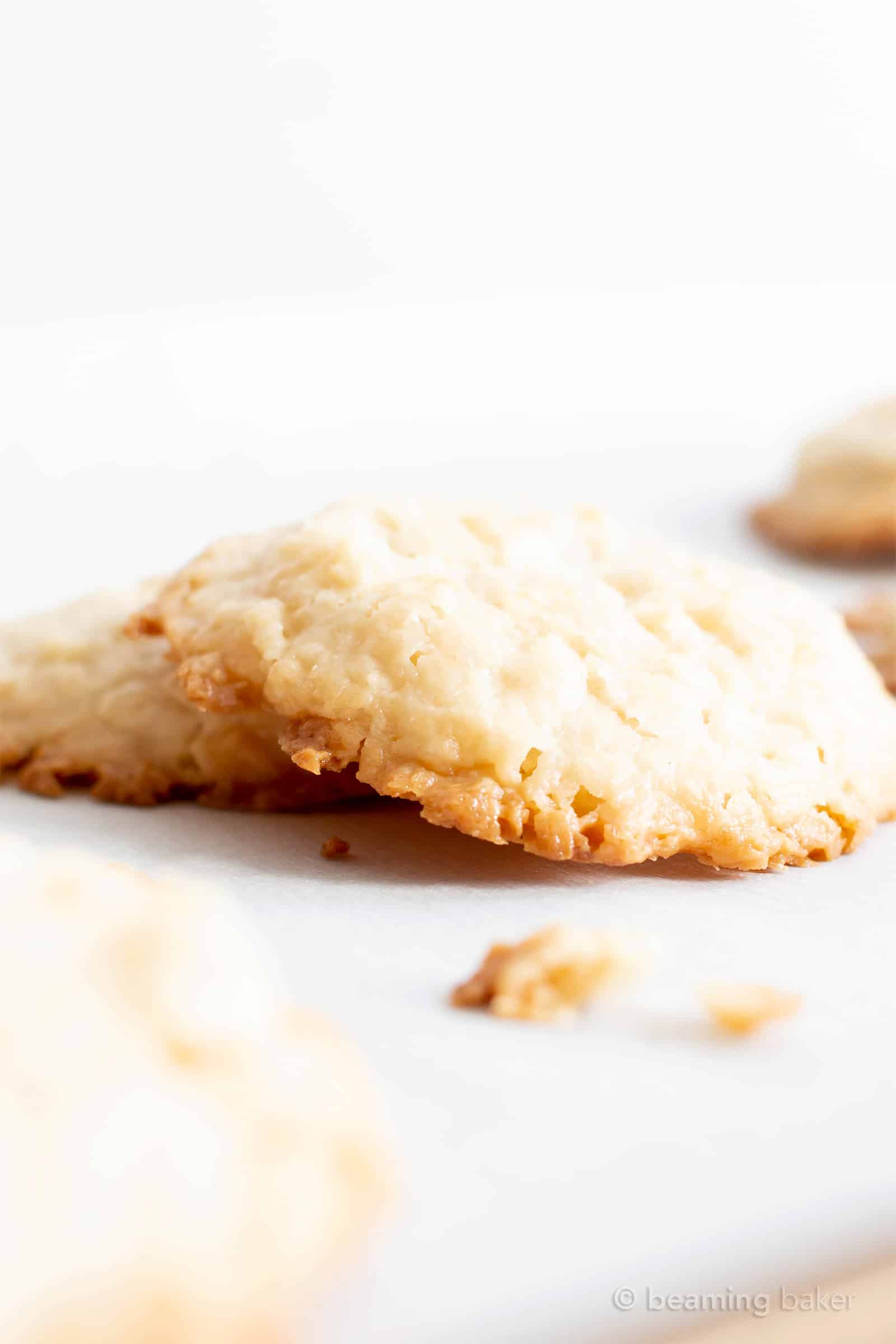 4 Ingredient Vegan Coconut Cookies: chewy, crispy healthy coconut cookies bursting with coconut flavor. The best gluten free coconut cookies—paleo ingredients, delicious! #Vegan #Cookies #Paleo #Healthy #Coconut | Recipe at BeamingBaker.com