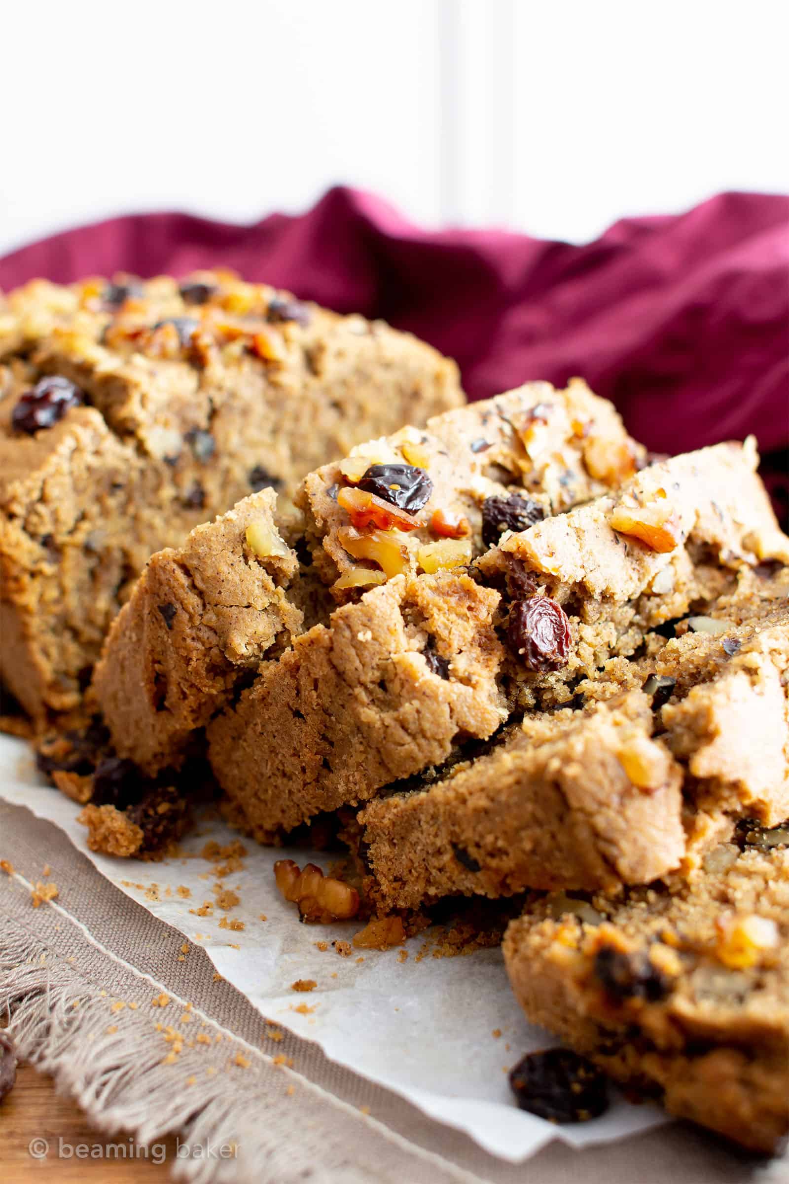 Vegan Cinnamon Raisin Quick Bread Recipe: rich, moist vegan quick bread bursting with juicy raisins under a blanket of warm cinnamon flavor. Gluten Free. Made with simple, whole ingredients. #Vegan #GlutenFree #Cinnamon #Raisin #Bread | Recipe at BeamingBaker.com