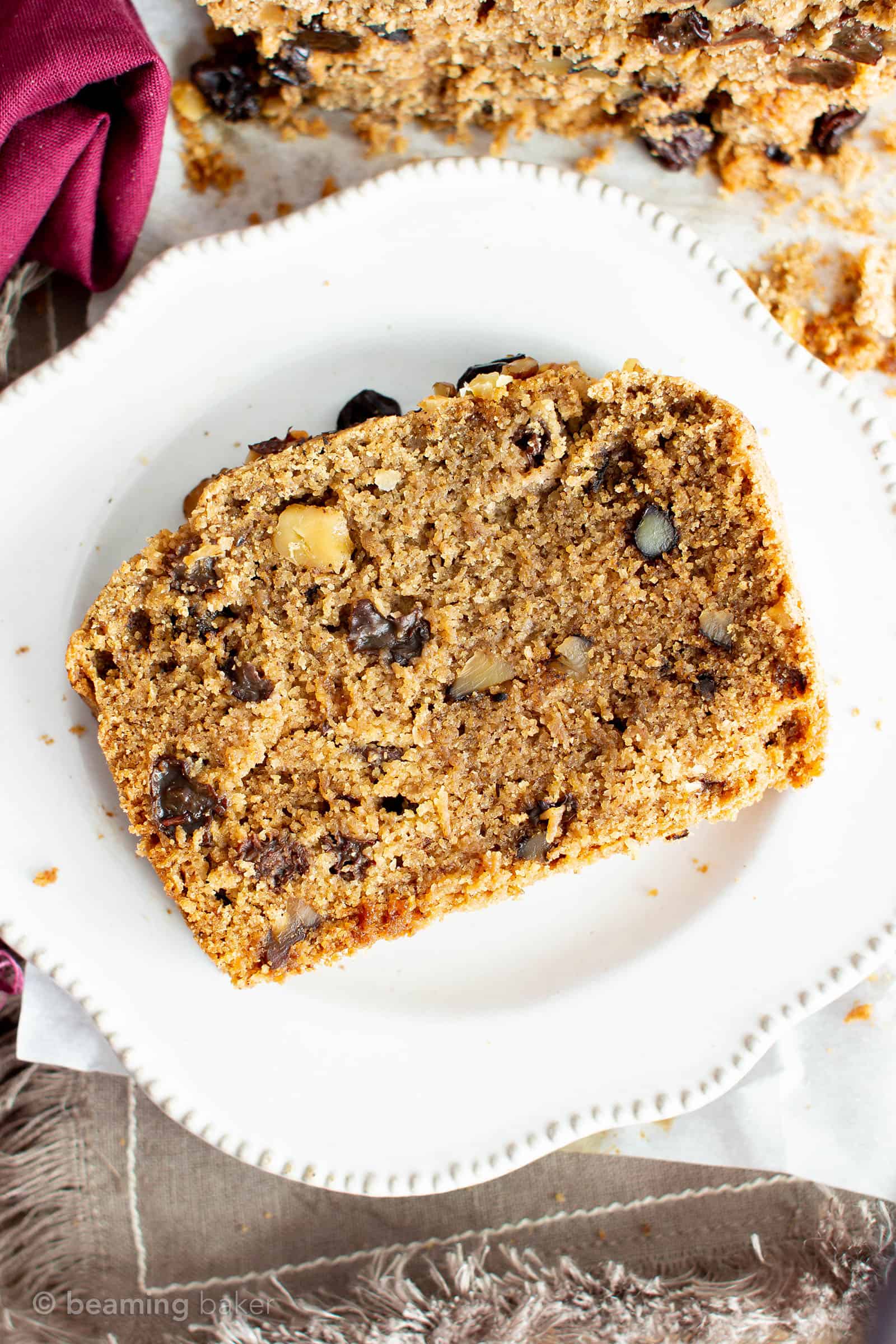 Vegan Cinnamon Raisin Quick Bread Recipe: rich, moist vegan quick bread bursting with juicy raisins under a blanket of warm cinnamon flavor. Gluten Free. Made with simple, whole ingredients. #Vegan #GlutenFree #Cinnamon #Raisin #Bread | Recipe at BeamingBaker.com