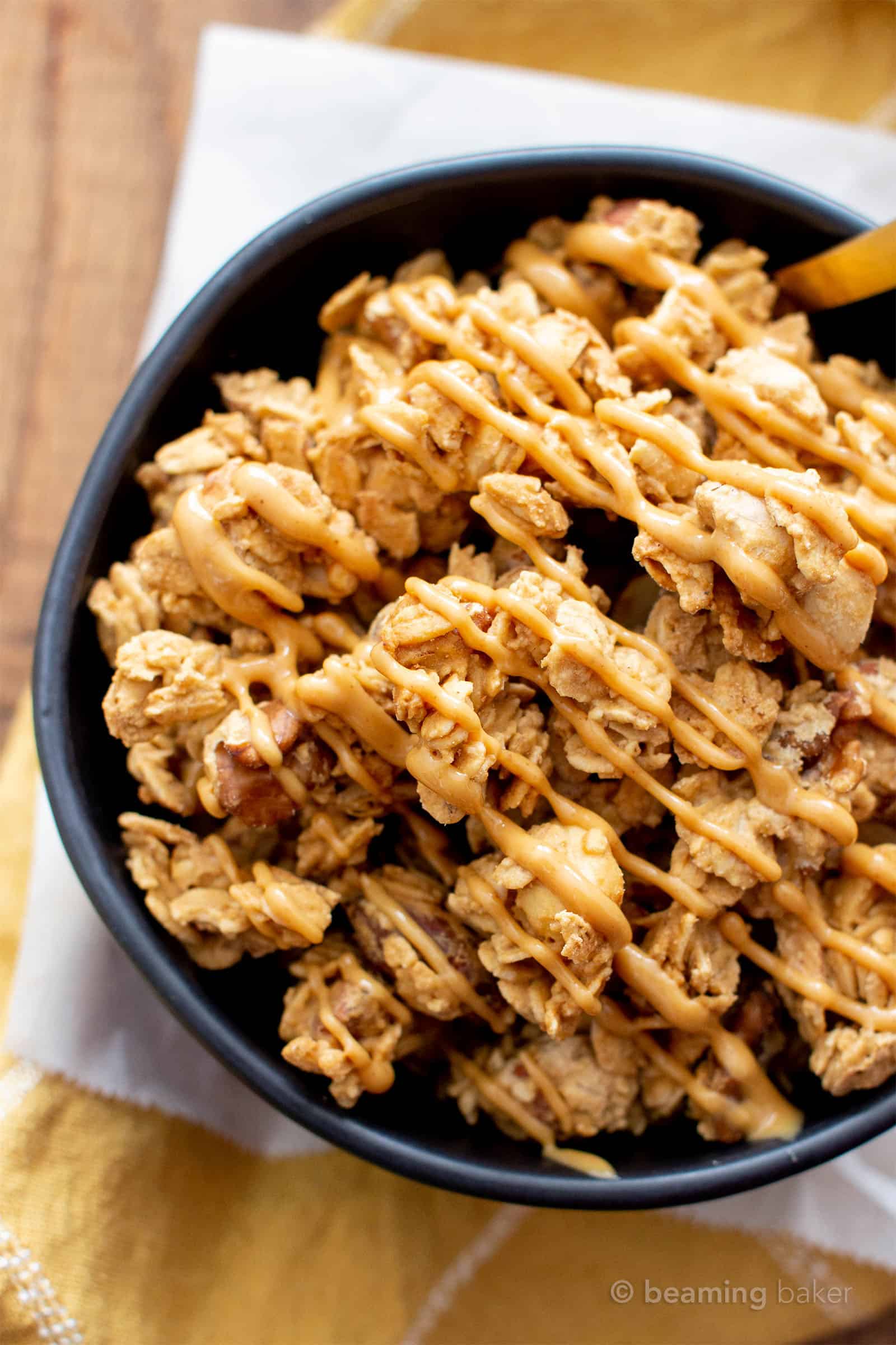 Overhead close up photo of homemade peanut butter granola in a bowl