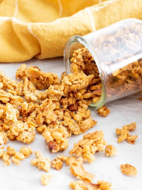 Close up of a spoon full of low calorie granola to show crunchy clusters.