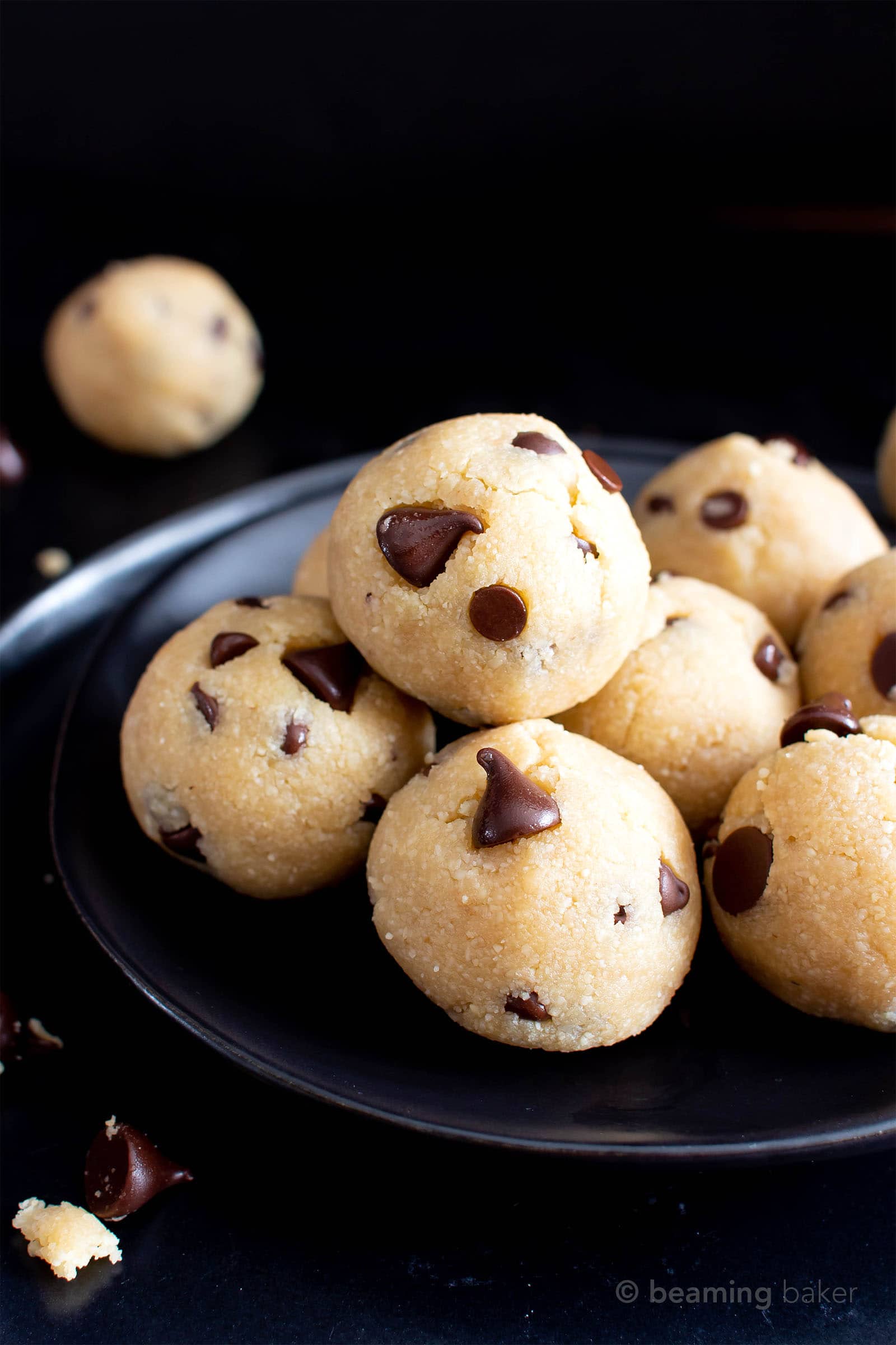 Paleo Cookie Dough Bites (V, GF): this decadent paleo edible cookie dough balls recipe is made with almond flour, just 6 healthy ingredients, easy & gluten-free! It’s the best vegan chocolate chip cookie dough bites recipe ever! #CookieDough #Paleo #Vegan #Chocolate | Recipe at BeamingBaker.com