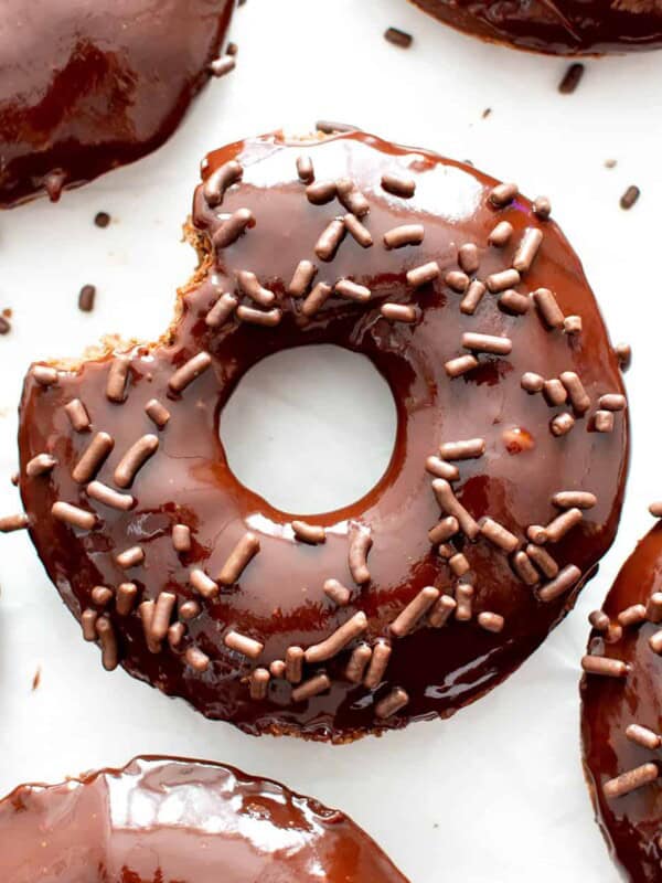 Vegan Gluten Free Donuts: soft ‘n fluffy vegan gf chocolate donuts topped with luxurious vegan chocolate glaze. The best gluten free vegan donut recipe! #GlutenFreeVegan #VeganGlutenFree #Donuts #Doughnuts #Chocolate | Recipe at BeamingBaker.com