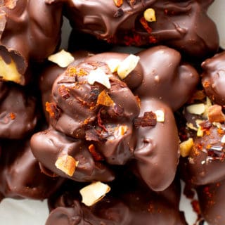Dark Chocolate Chili Nut Clusters Recipe (V, GF): this homemade chocolate nut clusters recipe is healthy, easy and decadent! It’s the perfect dark chocolate treat – spicy, rich, packed with sweet nut clusters & prep’d in 15 minutes! #Chocolate #Vegan #Dessert #Nuts | Recipe at BeamingBaker.com
