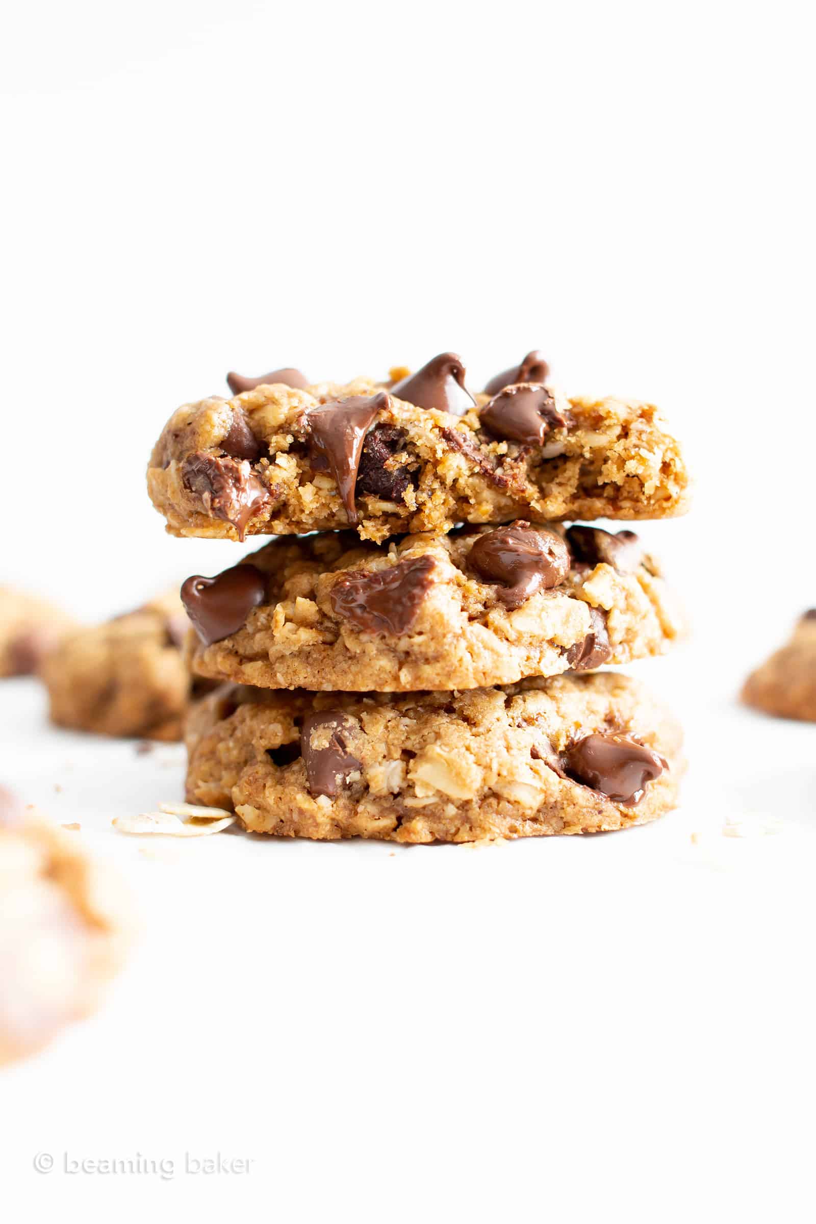 Best Gluten Free Oatmeal Chocolate Chip Cookies Recipe (GF, Vegan, Dairy-Free): this easy vegan oatmeal chocolate chip cookies recipe has a crispy exterior, soft & chewy interior, with cozy oatmeal flavor. It’s the best GF oatmeal chocolate chip cookies – gluten free, dairy-free and made with healthy ingredients! #Vegan #GlutenFree #ChocolateChip #Cookies #DairyFree #Oatmeal | Recipe at BeamingBaker.com