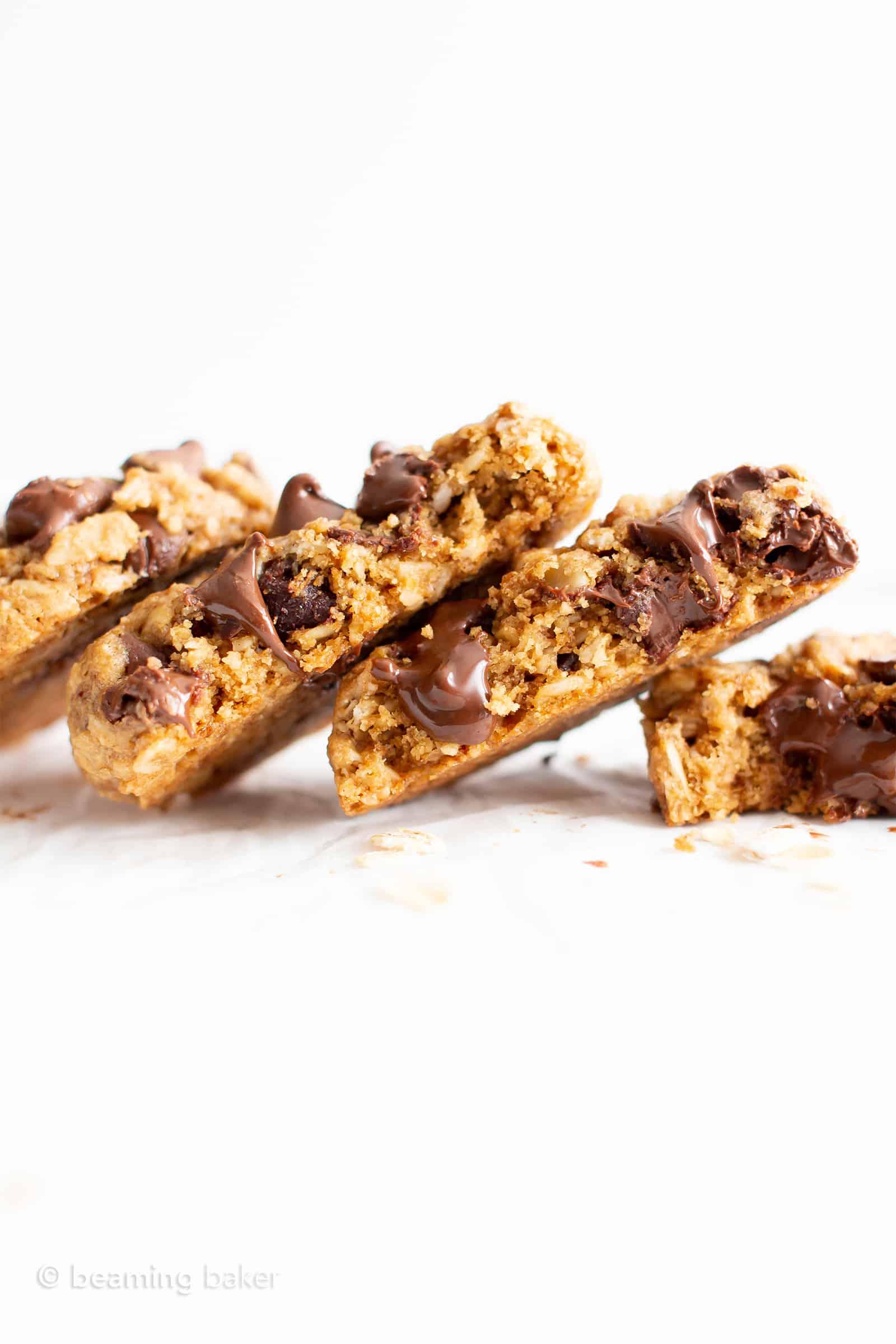 Row of gluten free oatmeal cookies leaning on each other.