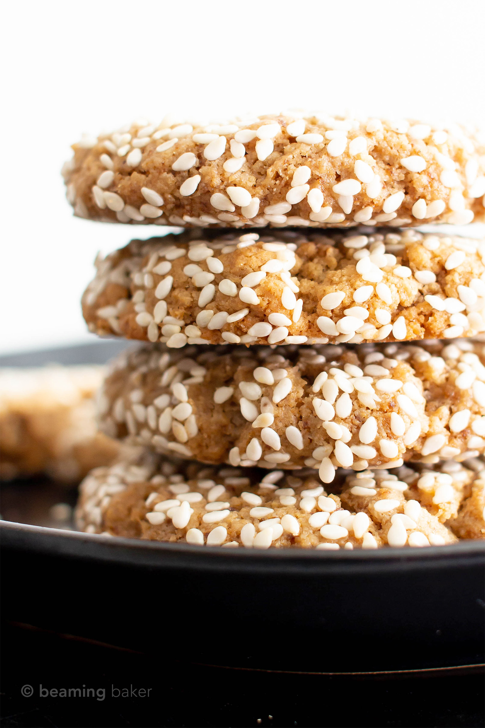 Vegan Sesame Tahini Cookies (Gluten Free): just 7 ingredients for the best vegan tahini cookies—buttery-rich, crisp sesame coating, tender on the inside. Delicious sesame tahini cookies that are gluten free! #Vegan #Sesame #Tahini #GlutenFree #Cookies | Recipe at BeamingBaker.com