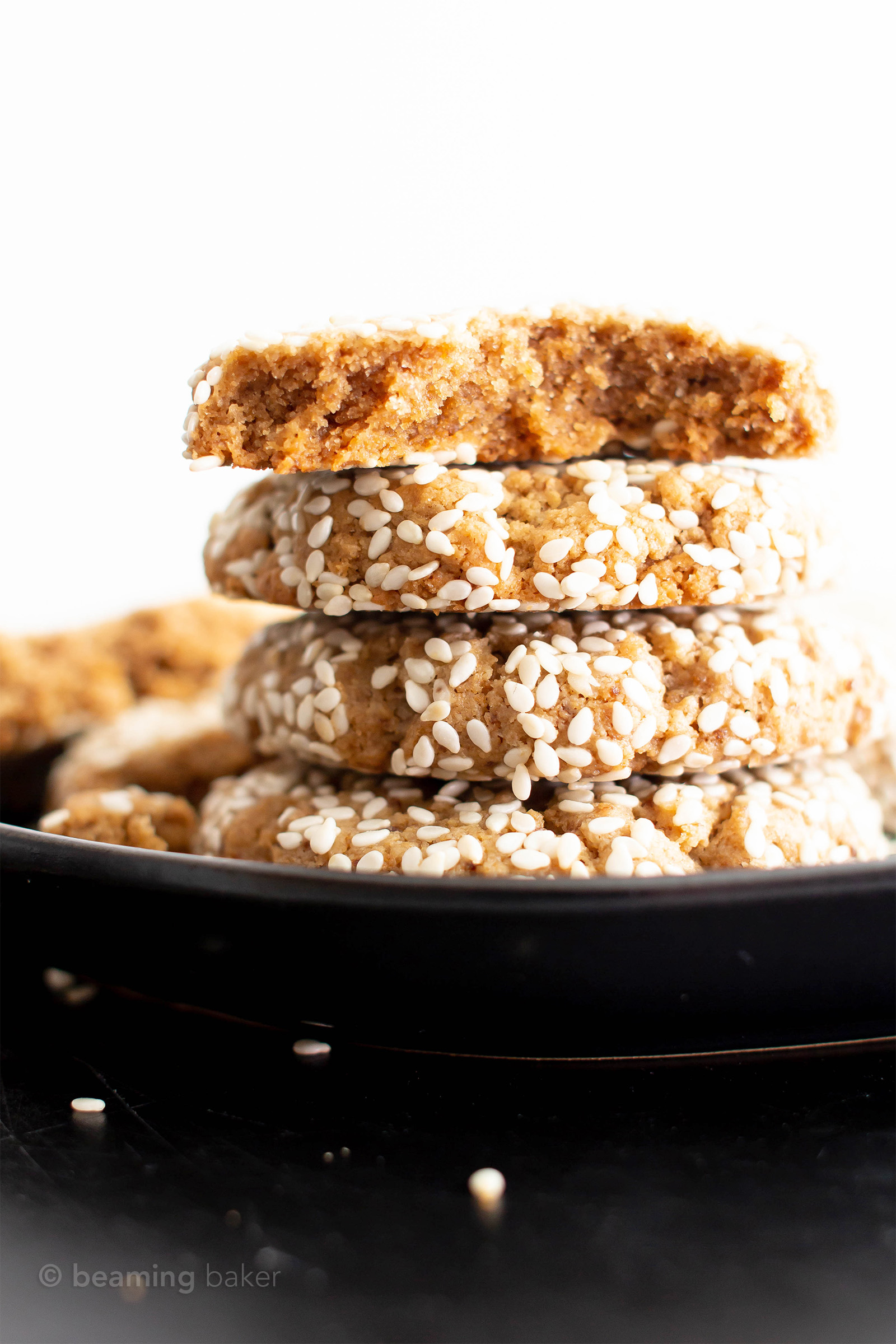 Vegan Sesame Tahini Cookies (Gluten Free): just 7 ingredients for the best vegan tahini cookies—buttery-rich, crisp sesame coating, tender on the inside. Delicious sesame tahini cookies that are gluten free! #Vegan #Sesame #Tahini #GlutenFree #Cookies | Recipe at BeamingBaker.com