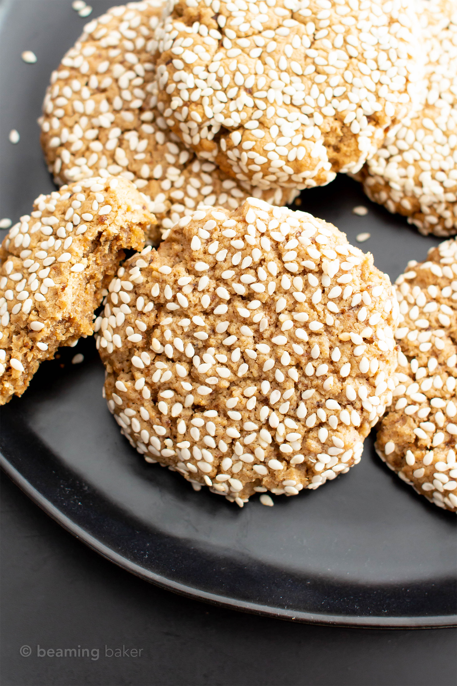 Vegan Sesame Tahini Cookies (Gluten Free): just 7 ingredients for the best vegan tahini cookies—buttery-rich, crisp sesame coating, tender on the inside. Delicious sesame tahini cookies that are gluten free! #Vegan #Sesame #Tahini #GlutenFree #Cookies | Recipe at BeamingBaker.com