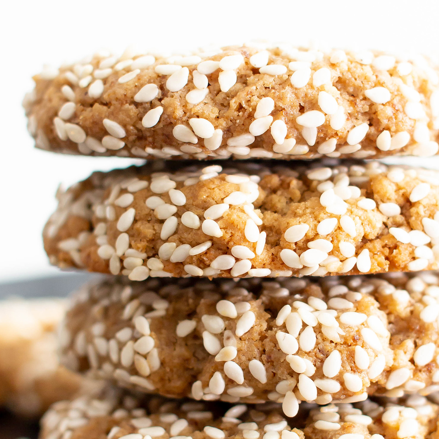 Vegan Sesame Tahini Cookies (Gluten Free): just 7 ingredients for the best vegan tahini cookies—buttery-rich, crisp sesame coating, tender on the inside. Delicious sesame tahini cookies that are gluten free! #Vegan #Sesame #Tahini #GlutenFree #Cookies | Recipe at BeamingBaker.com