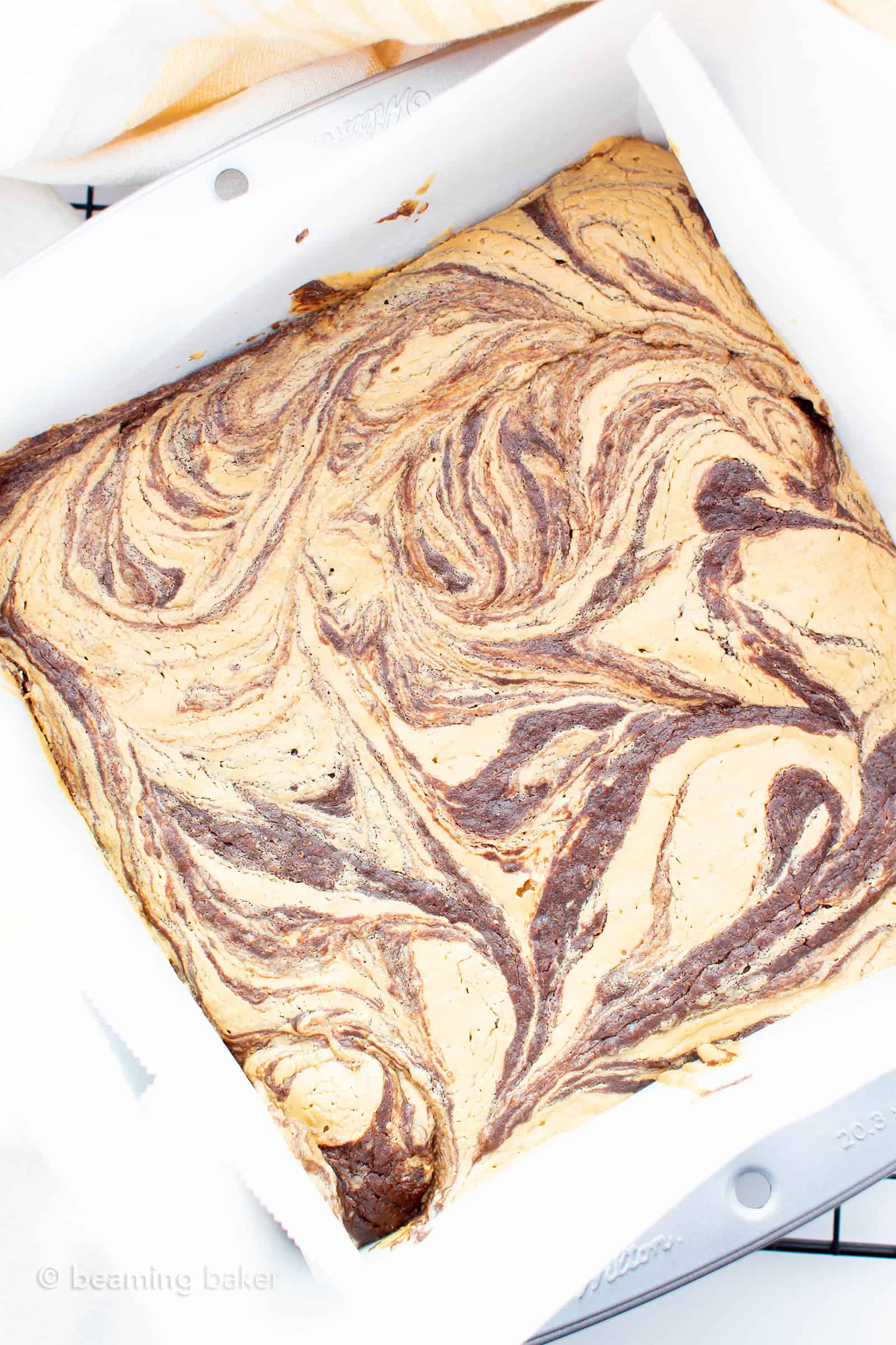 Fudgy Vegan Peanut Butter Swirl Brownies (Gluten Free): this vegan gluten free brownies recipe is made from scratch & easy! It’s the fudgiest chocolate peanut butter swirl brownies ever—with thick ribbons of peanut butter and rich, moist brownie flavor! #Vegan #Brownies #GlutenFree #DairyFree #PeanutButter | Recipe at BeamingBaker.com