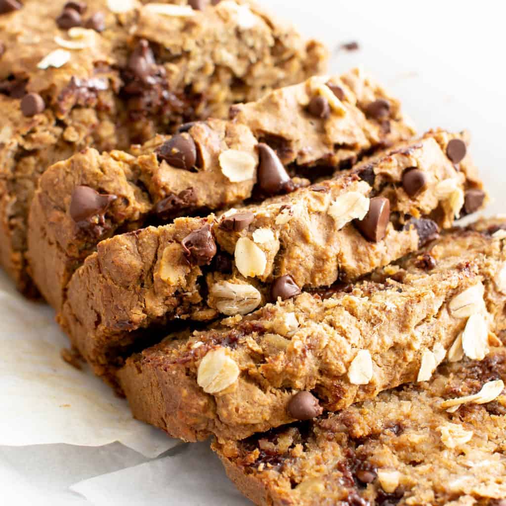 Super Moist Vegan Oatmeal Chocolate Chip Banana Bread (Gluten Free): a healthy banana bread recipe with oats & chocolate! It’s the ultimate vegan oatmeal banana bread—moist, gluten free, dairy-free, made with GF oat flour! #Vegan #Bananas #GlutenFree #Oats #Chocolate | Recipe at BeamingBaker.com