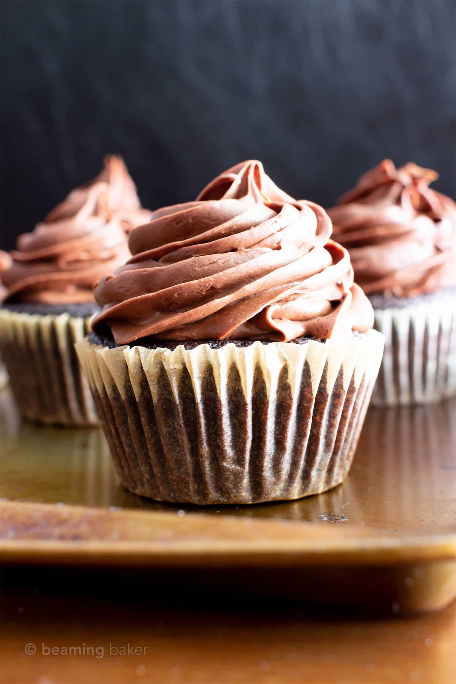 Paleo Chocolate Cupcakes Recipe (Almond Flour, GF): rich ‘n moist vegan gluten free cupcakes topped with creamy chocolate frosting! The best paleo cupcakes—made with gluten free, dairy free, healthy ingredients! #Vegan #Paleo #Cupcakes #GlutenFree #DairyFree | Recipe at BeamingBaker.com